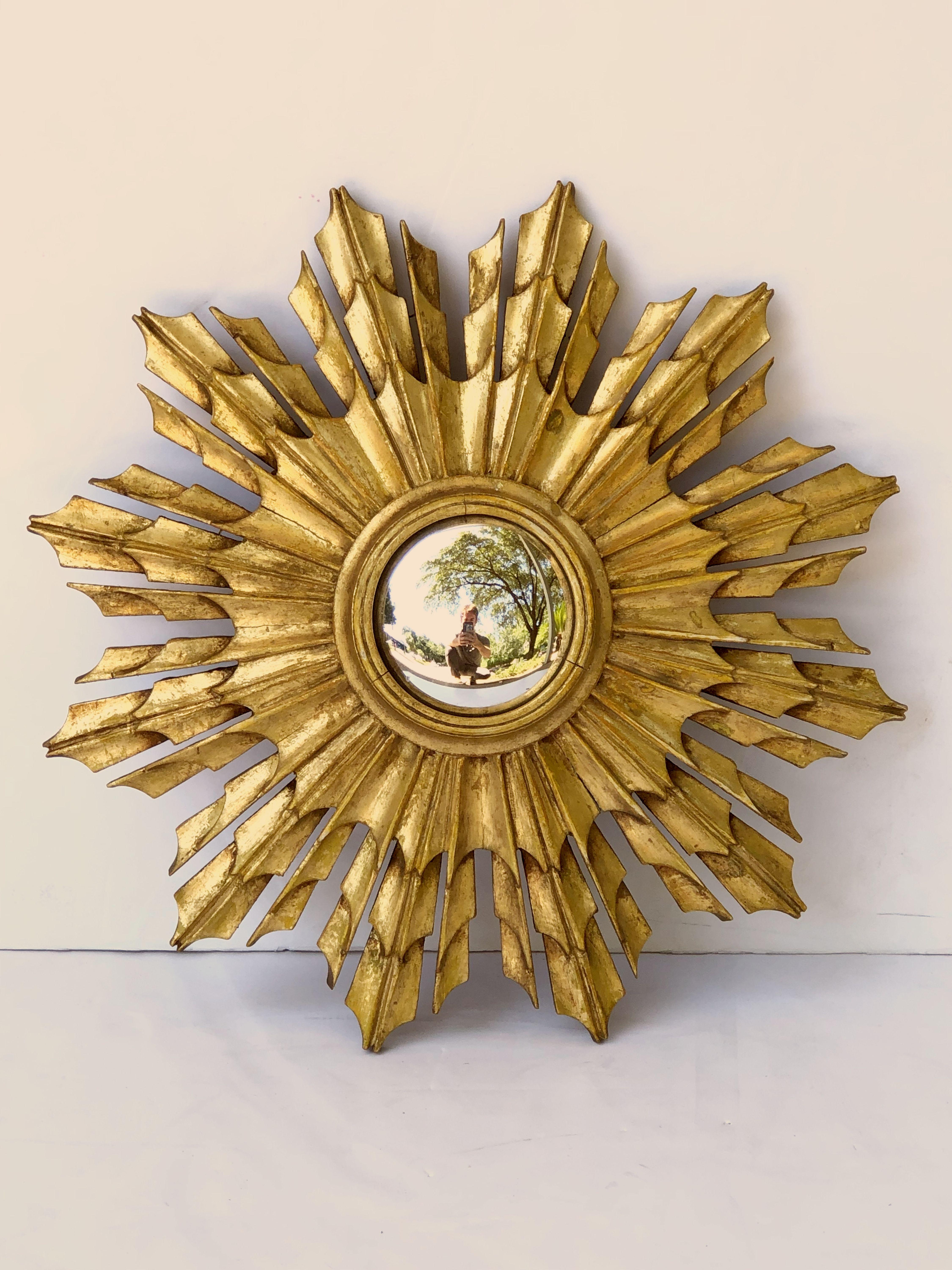 A lovely French gild sunburst (or starburst) mirror, 16 inches diameter with round mirrored convex glass center in a moulded frame.