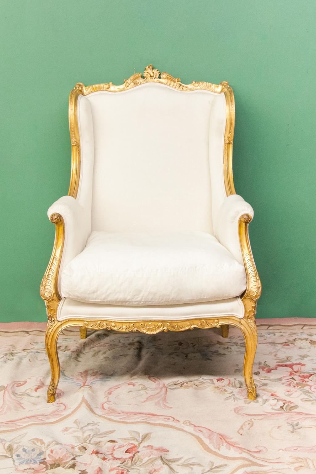 19th Century French Gilt Wing Chair For Sale
