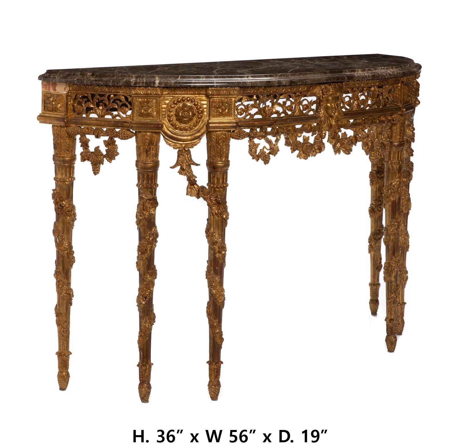 Beautiful French Louis XVI style carved giltwood demi-lune console table with marble top
Late 19th/early 20th century 
The Later demi-lune console table with a fitted taupe replaced marble top over a carved giltwood structure with openwork apron,