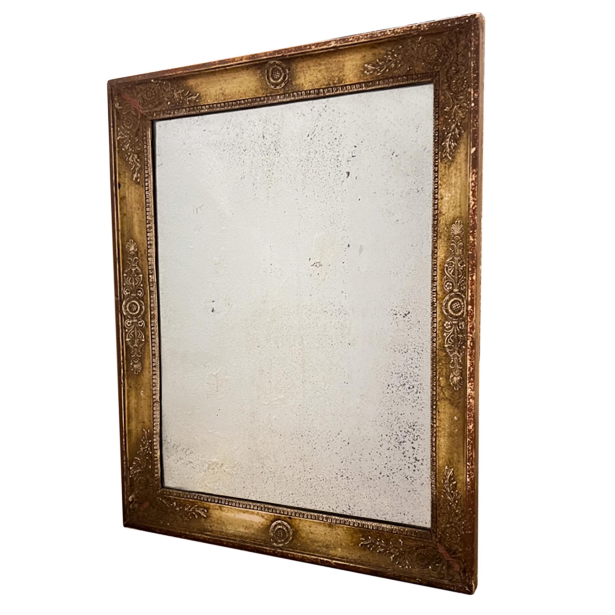 A very decorative French mirror which can be hung landscape or portrait. 

It has pretty moulding and very worn gilded frame . The mirror is the original plate - beautiful glass, heavily foxed which is consistent with it's age. 

Made in the 19th