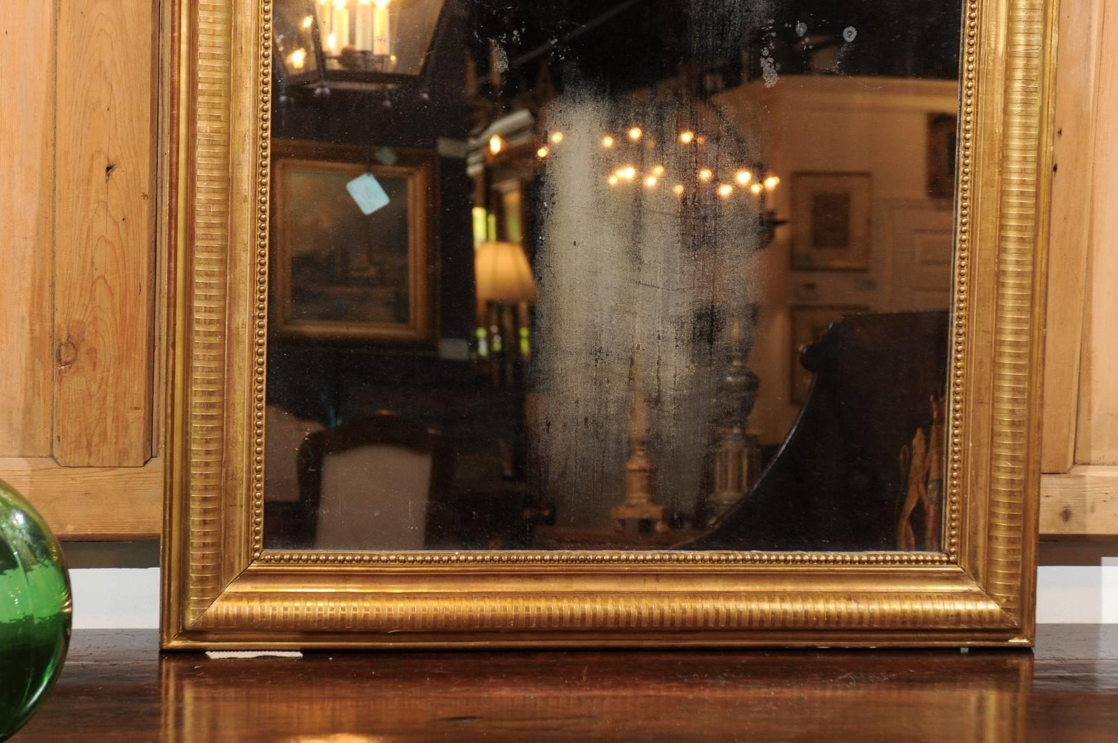 French Giltwood Louis-Philippe Mirror with Sinuous Top from the 19th Century For Sale 1