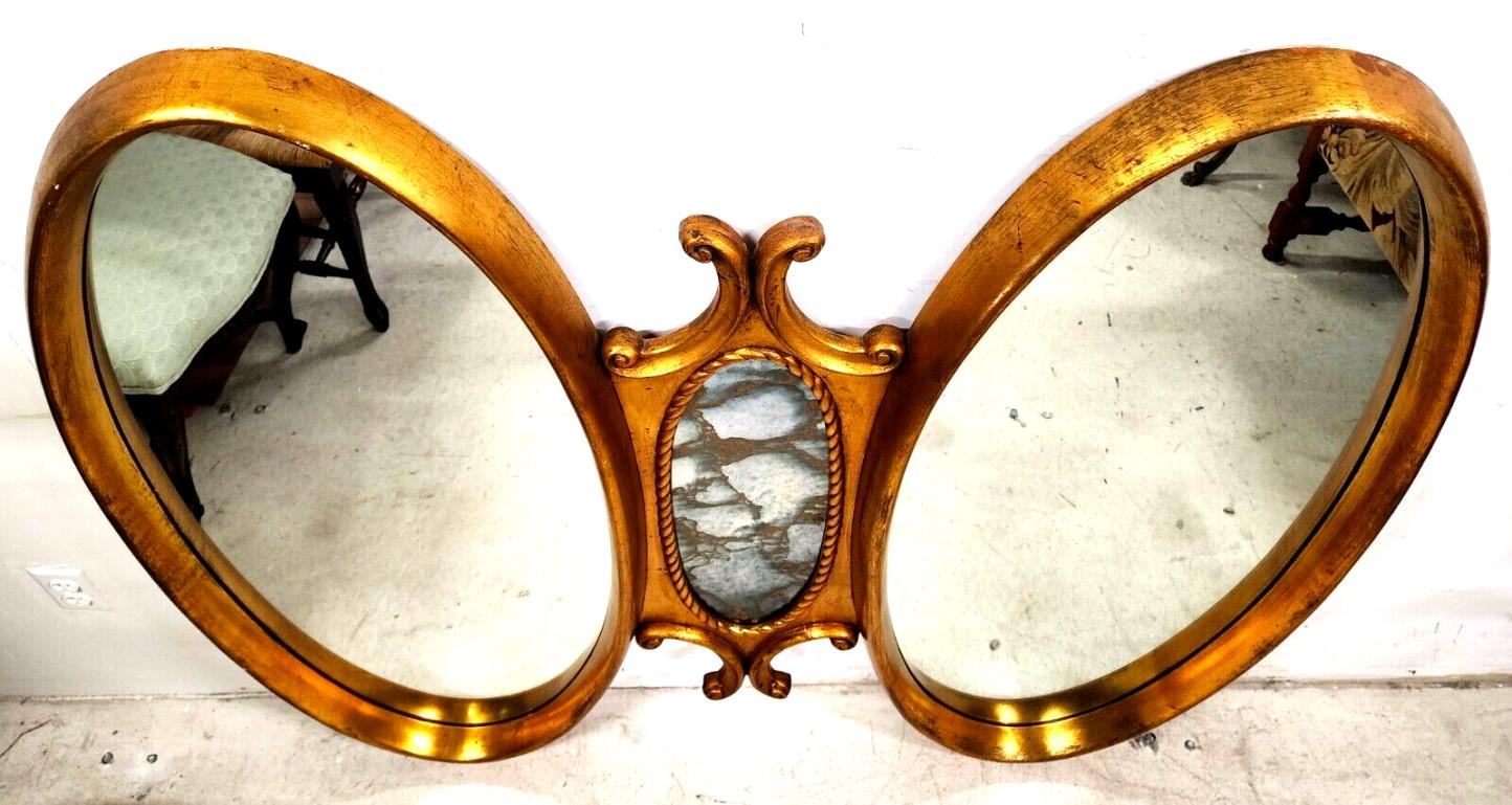 


Offering One Of Our Recent Palm Beach Estate Fine Furniture Acquisitions Of A 
Vintage Giltwood Mirror Gold Leaf Solid Wood 
Dual oval mirrors with an Eglomise center mirror.
Ready to hang.

Approximate Measurements in Inches
48