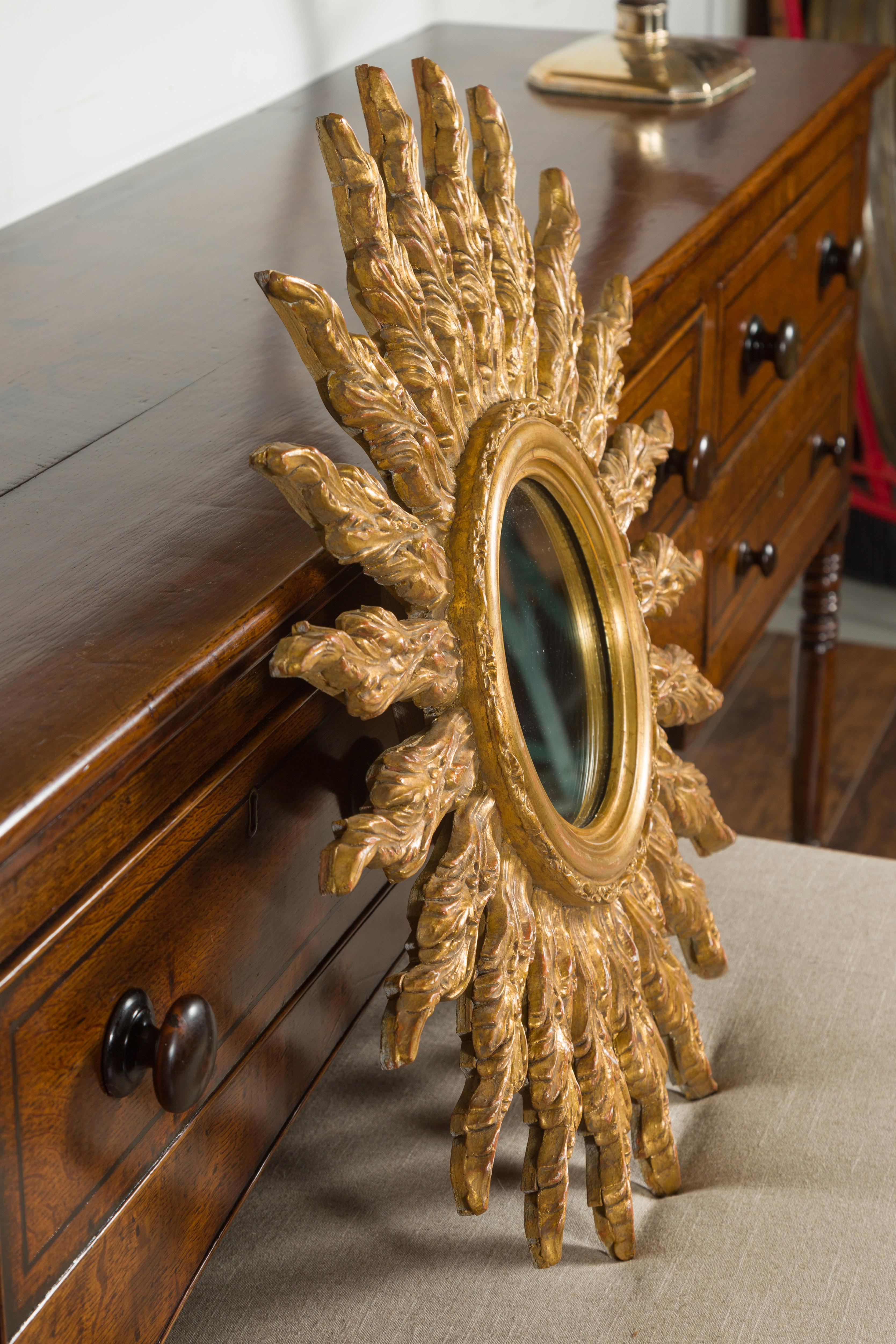 French Giltwood Sunburst Mirror with Wavy Sunrays from the Mid-20th Century For Sale 5