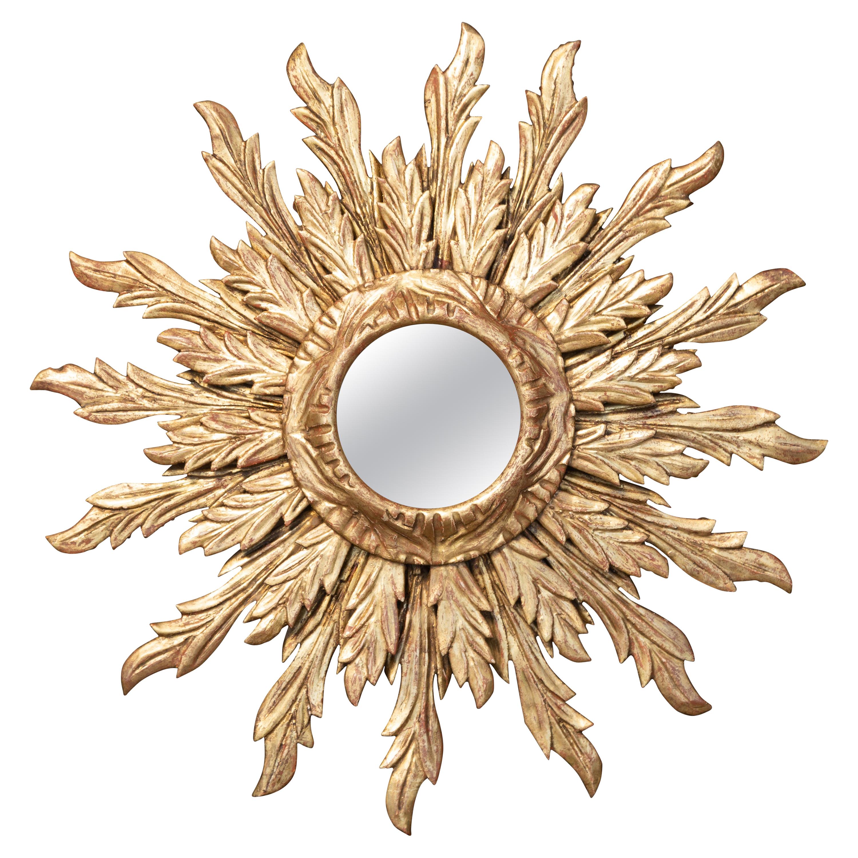 French Giltwood Sunburst Mirror with Wavy Sunrays from the Mid-20th Century