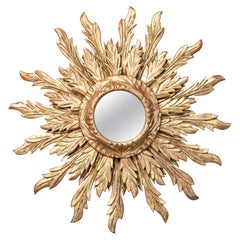 Retro French Giltwood Sunburst Mirror with Wavy Sunrays from the Mid-20th Century