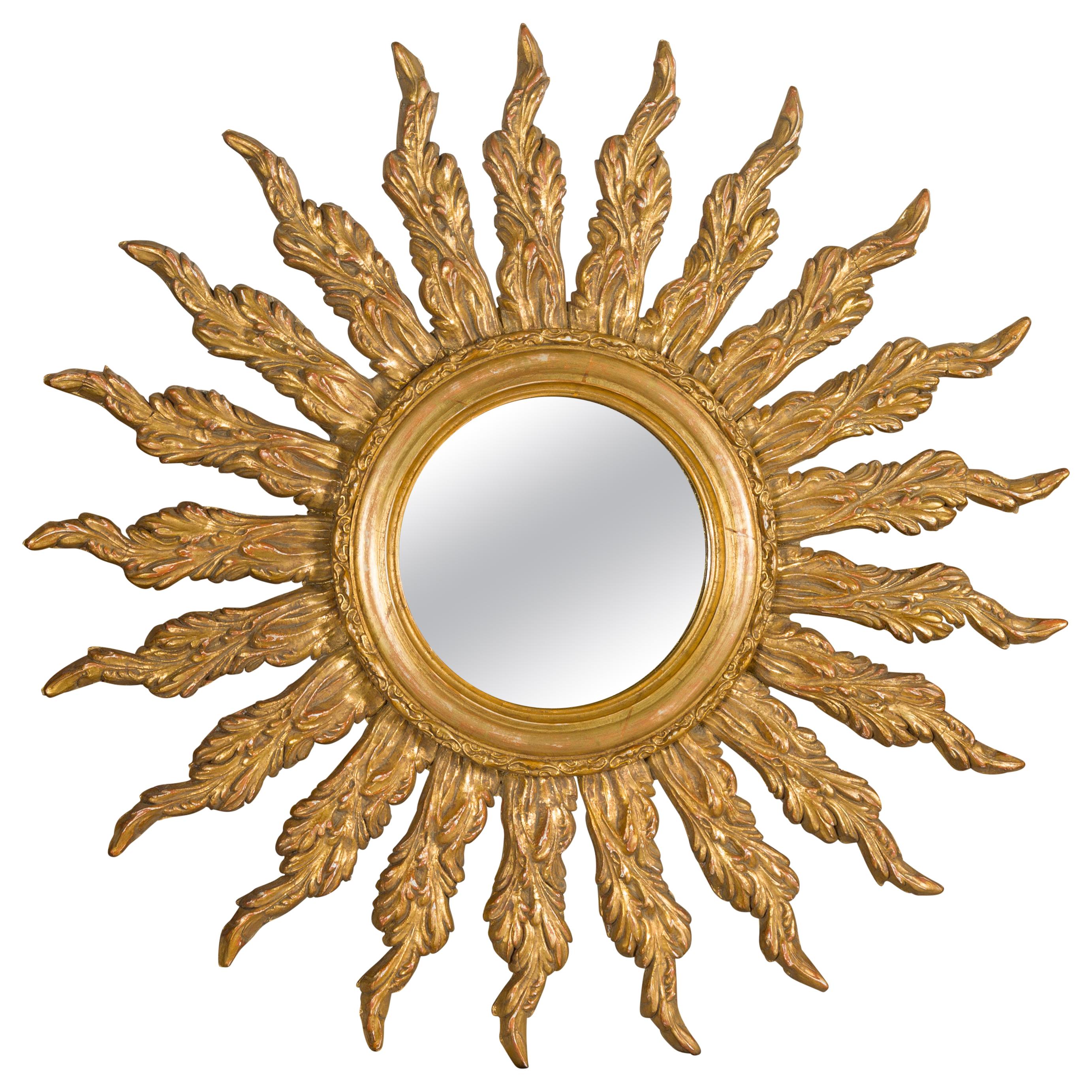 French Giltwood Sunburst Mirror with Wavy Sunrays from the Mid-20th Century