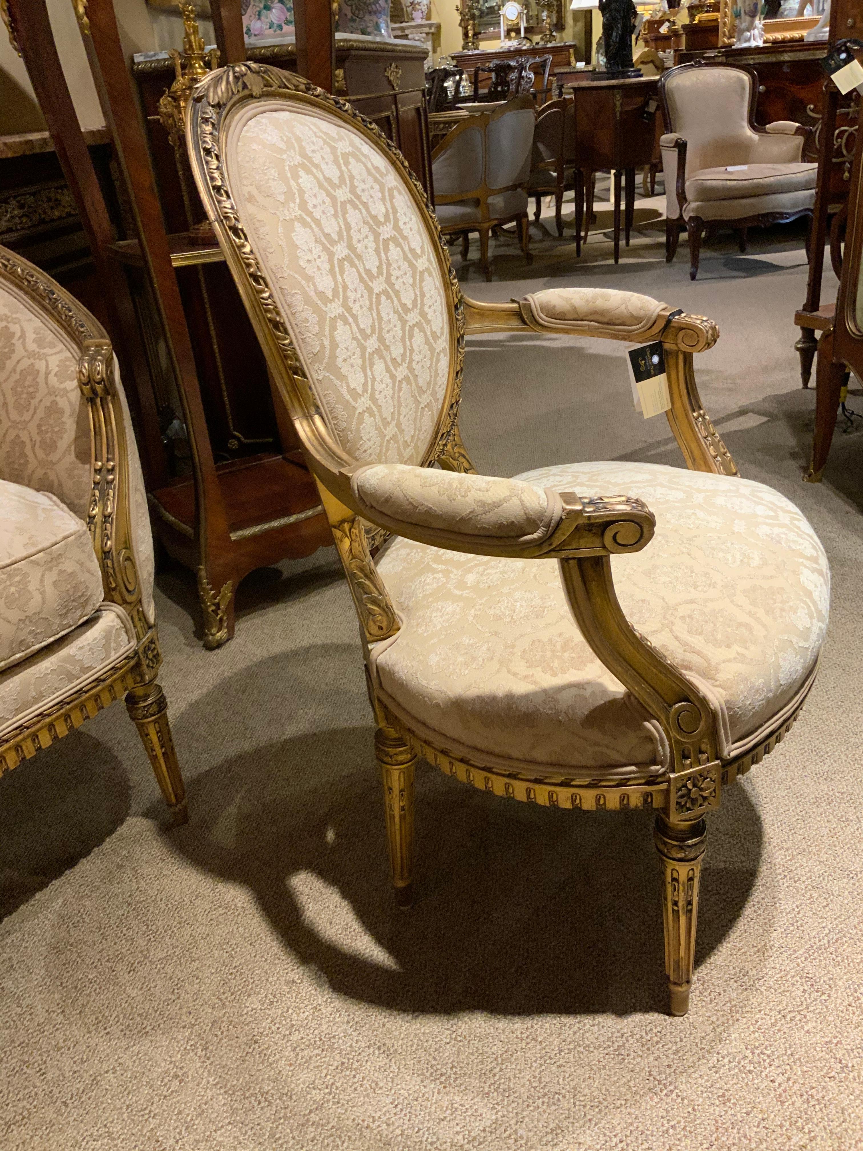 19th Century French Giltwood Three Piece Love Seat with Two Arm Chairs in Cream Hue For Sale