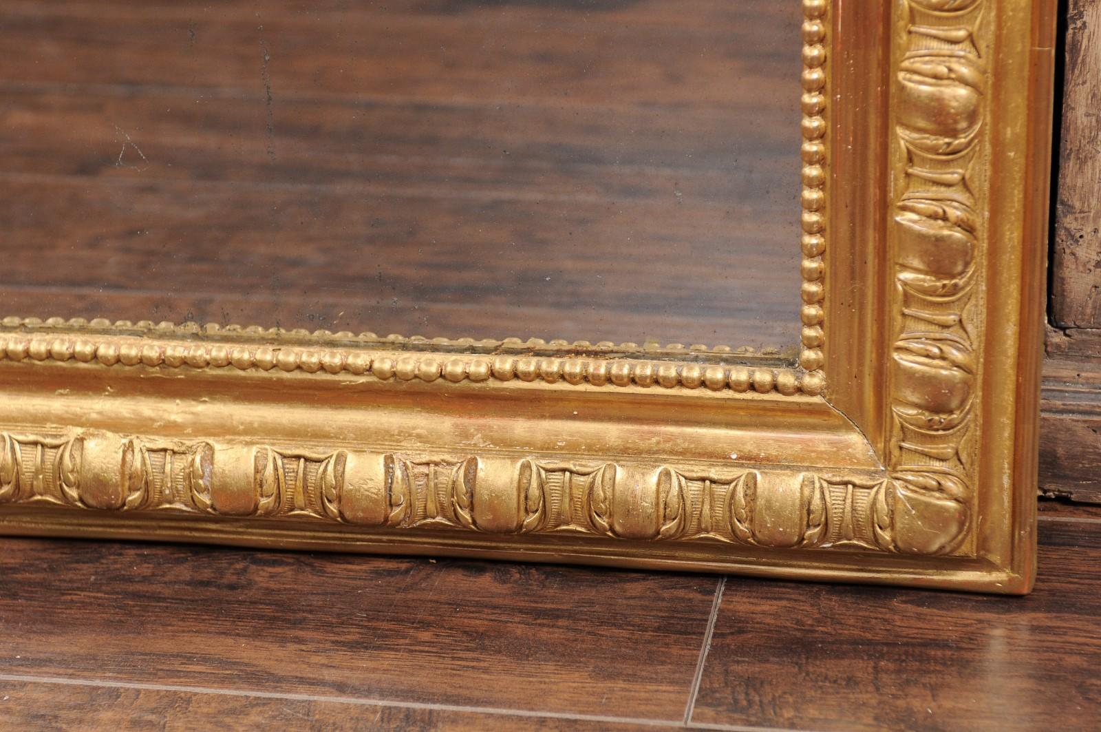 20th Century French Giltwood Wall Mirror with Carved Frame and Beaded Motifs, circa 1900