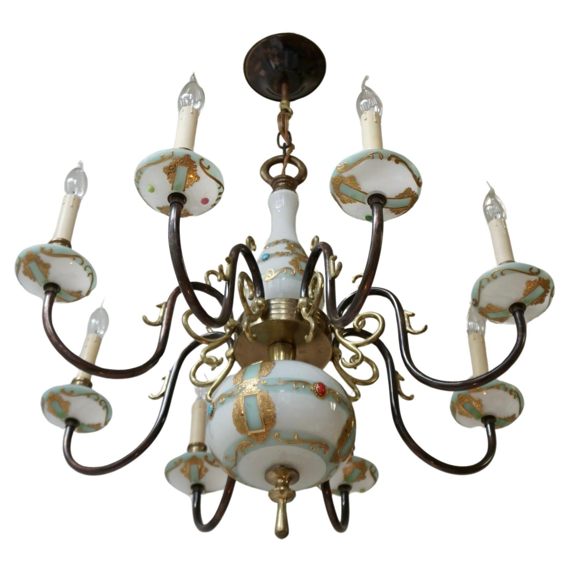 French glass and bronze chandelier 8 arm lights Hollywood Regency.

The light is in good vintage condition and full working order with a lovely patina of age. It requires 8 x E14 screw base bulbs or LEDs. This fixture can be worked in any country of