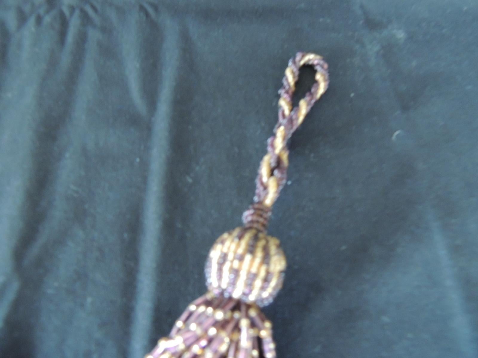 French glass beads decorative tassel.
handwoven key tassel with glass and acrylic beads.
In shades of brown, burgundy and gold.
Size: 7