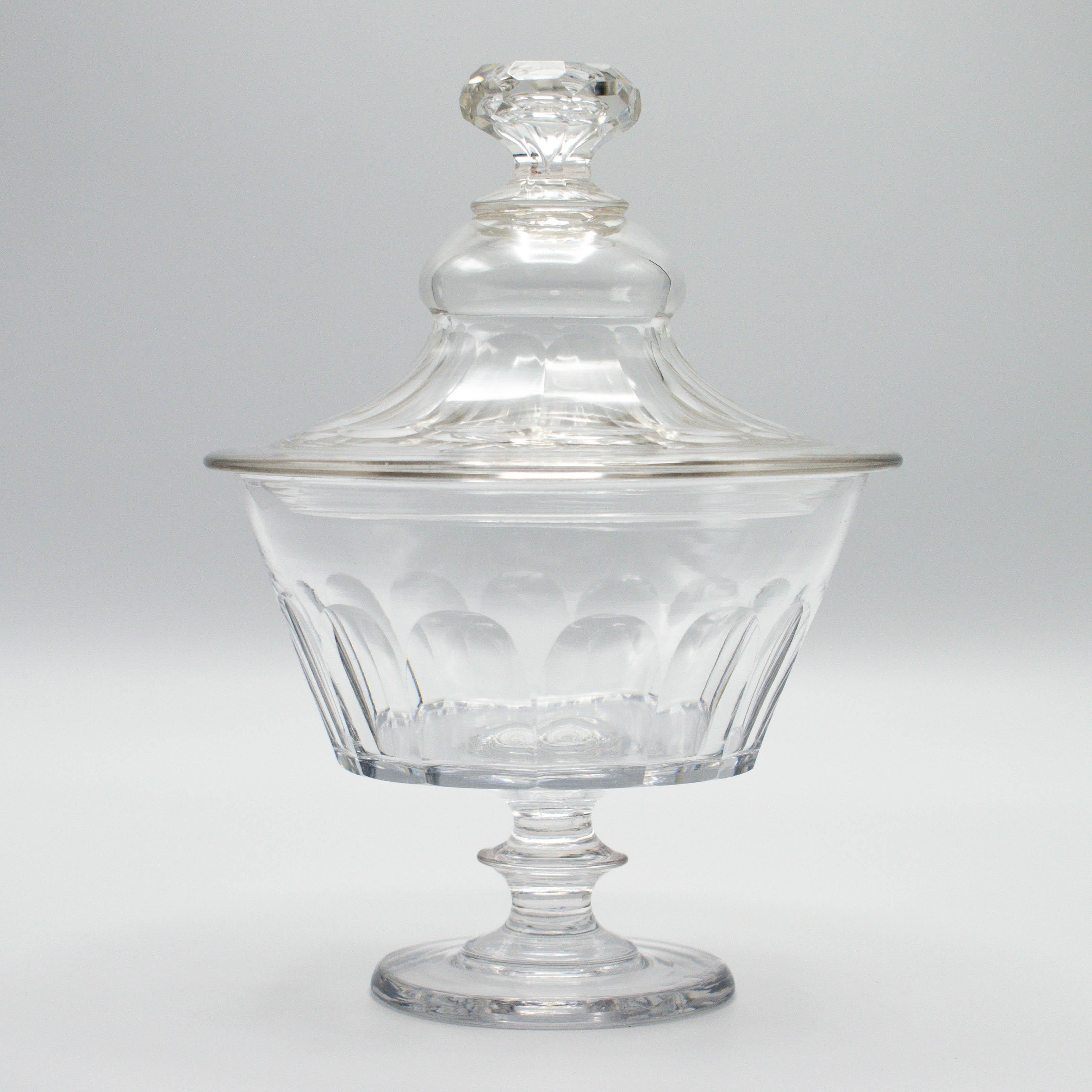 A small French glass lidded bon bon or candy jar with faceted sides, pedestal base and cut glass knob. Also perfect for use in a vanity. Purchased from a confiserie, or sweet shop, along many glass jars of various sizes. Please see other listings.