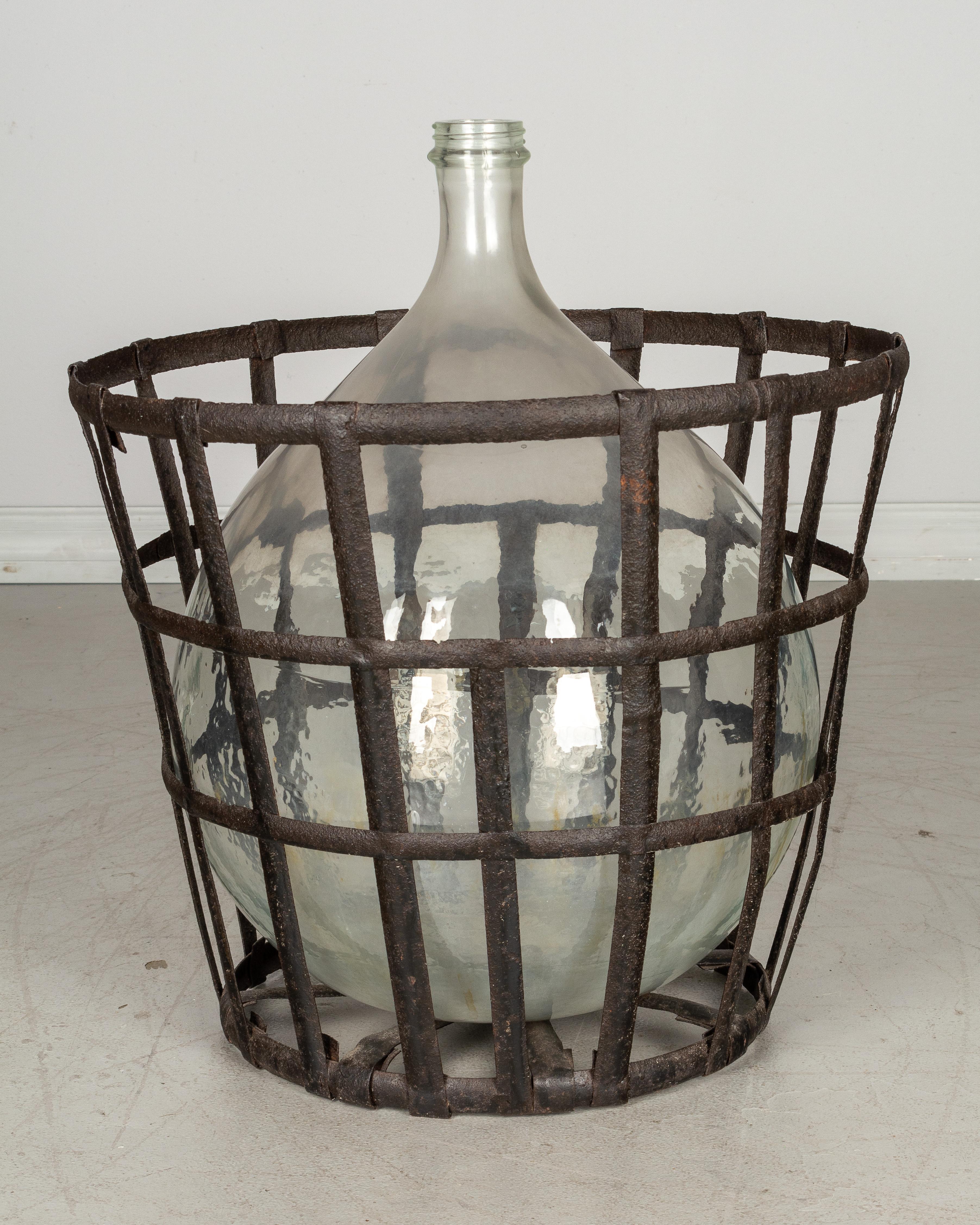 Hand-Crafted French Glass Demijohn Bottle in Metal Basket