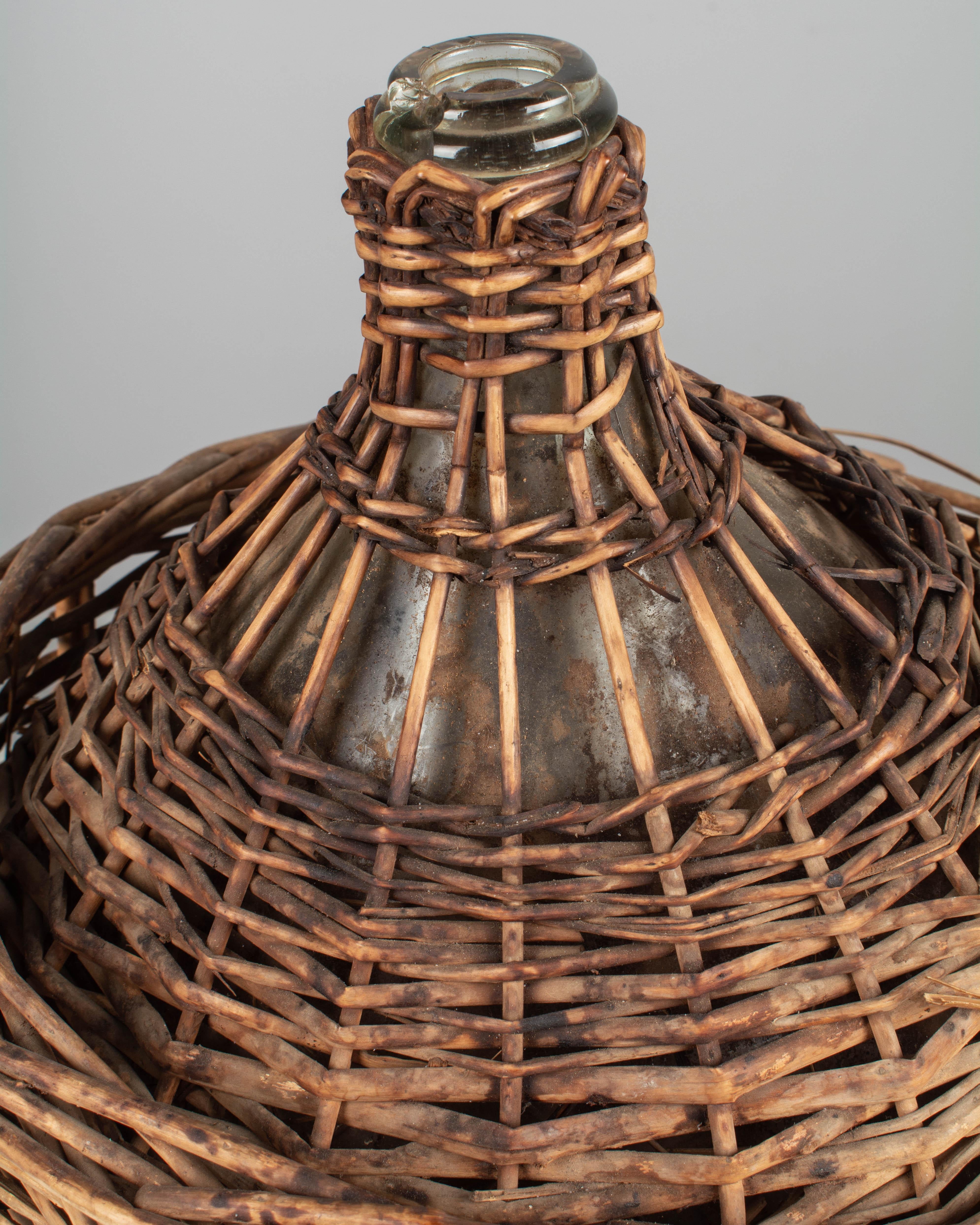 French Glass Demijohn Bottle in Woven Basket 2