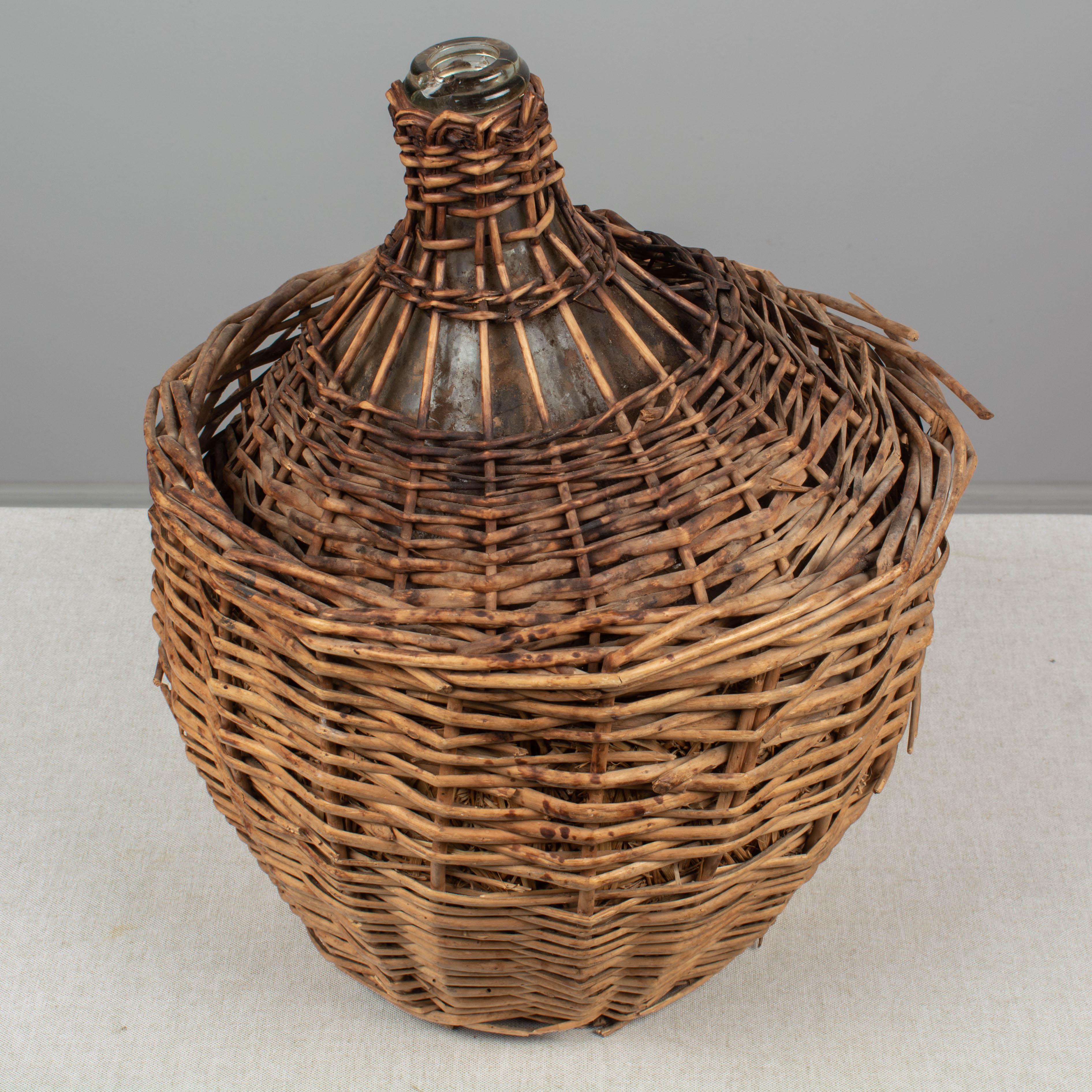Wicker French Glass Demijohn Bottle in Woven Basket