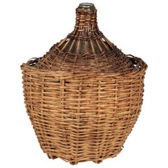 Antique French Glass Demijohn Bottle in Woven Basket