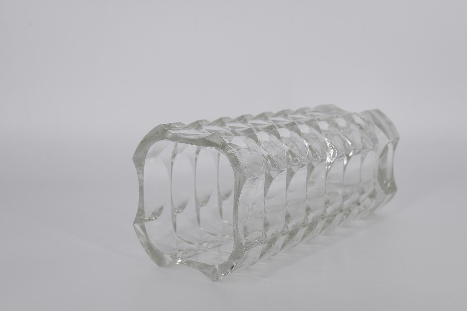 This tall, transparent Windsor vase was designed by J.G Durand for the French manufacture Luminarc during the 1970s. Made of cut pressed glass Verrerie d'Arques. Art deco vase with geometric relief, solidly made. It will work in any arrangement.