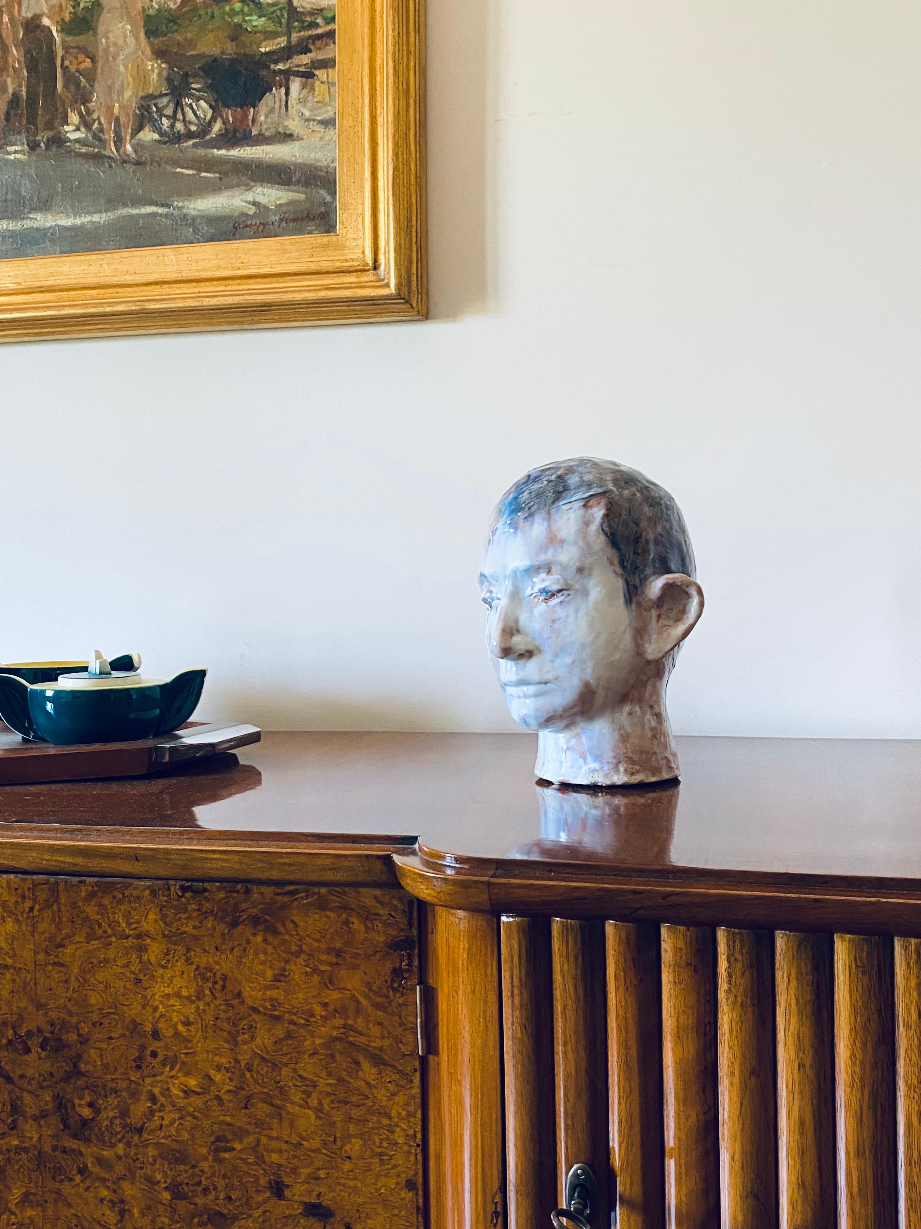 French glazed terracotta boy head.

France 1958.

Signed and dated on the base.

Blue, white, pink colors.

Measures : 30H x 22 cm

Conditions: Excellent.