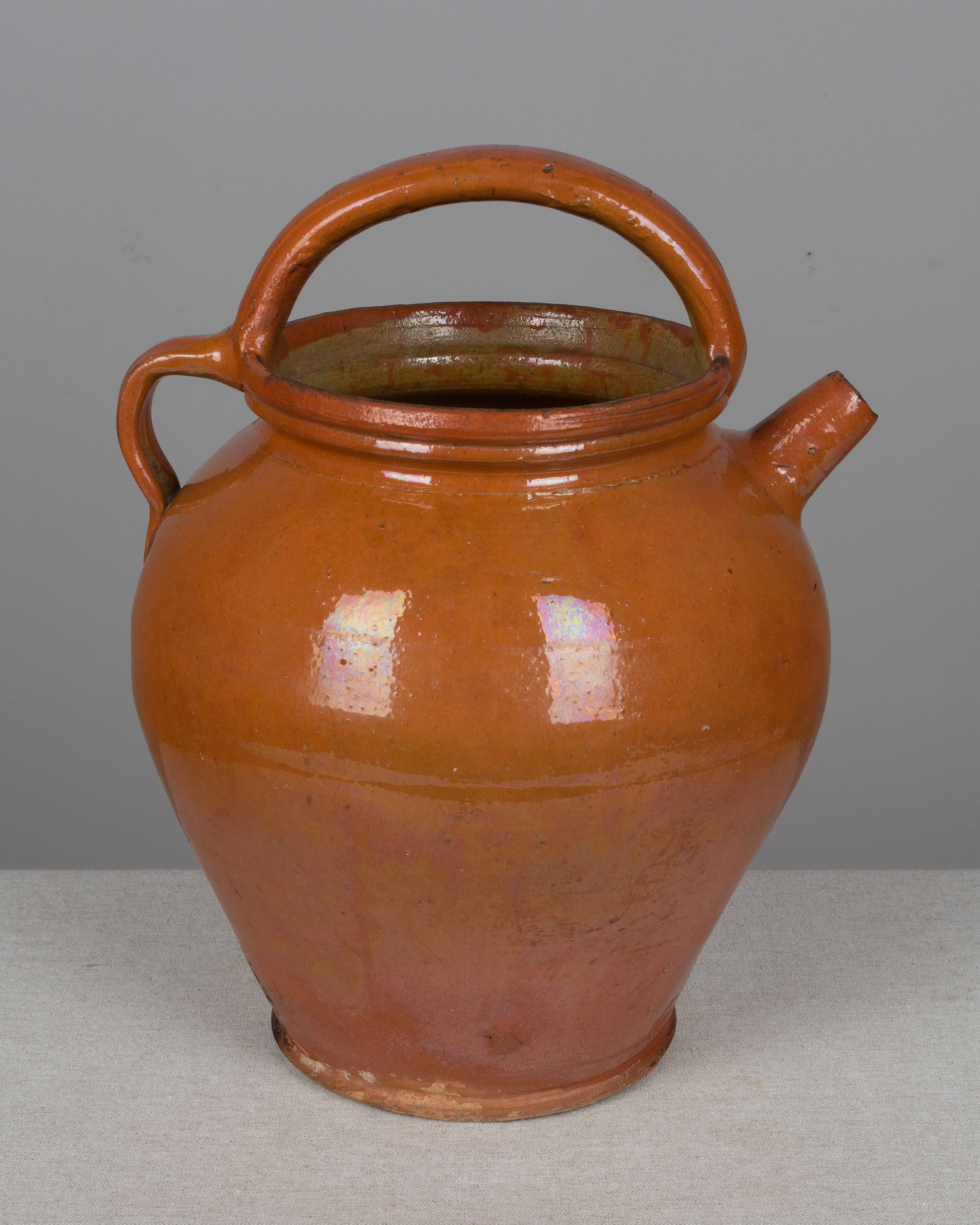 A large French glazed terracotta jug from the Southwest of France. Measure: 15