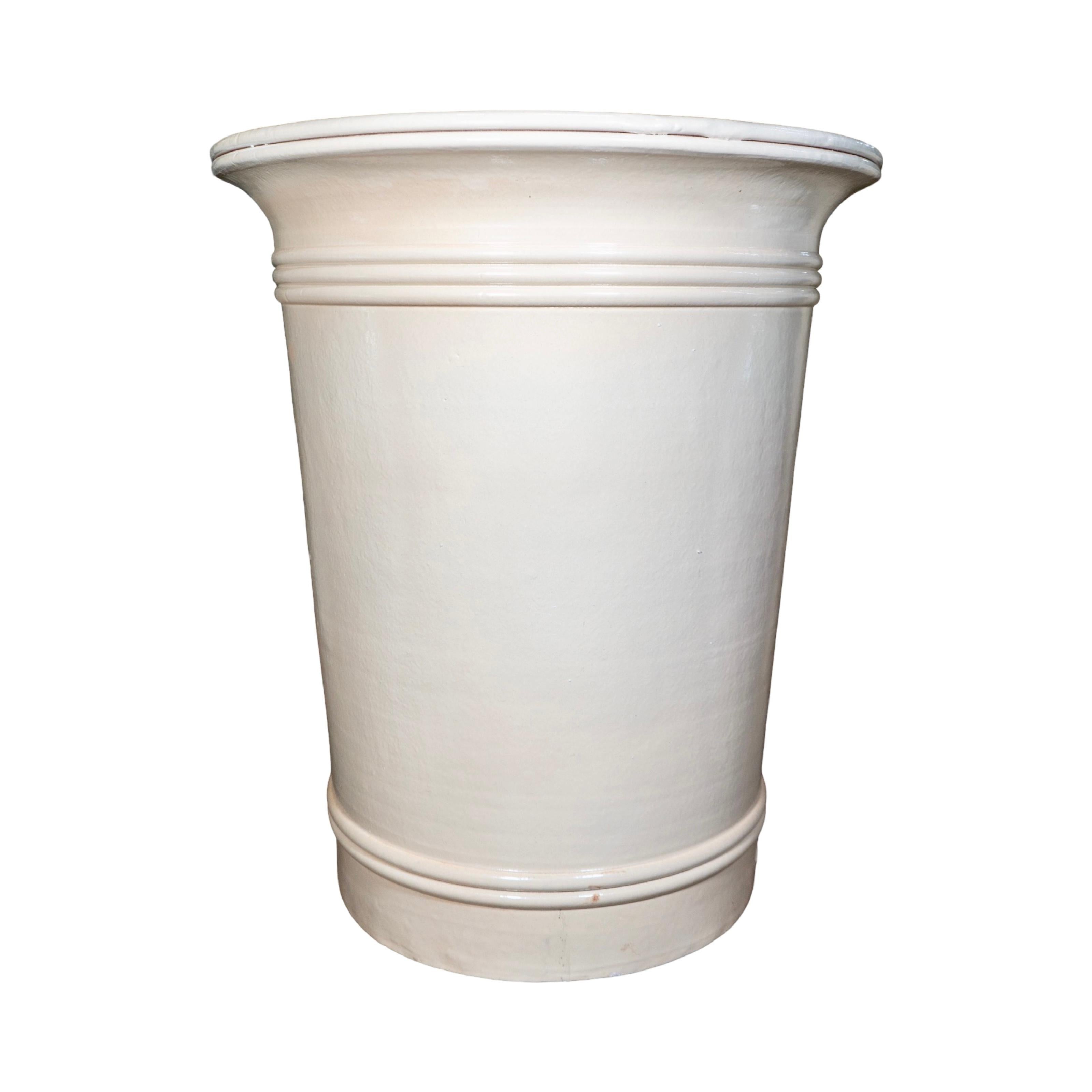 A contemporary vase-style planter from France, handcrafted from terracotta and finished with an ivory enamel glaze. Inspired by Art Deco design, it reflects the French pursuit of harmony between modernism and tradition. Made using the traditional