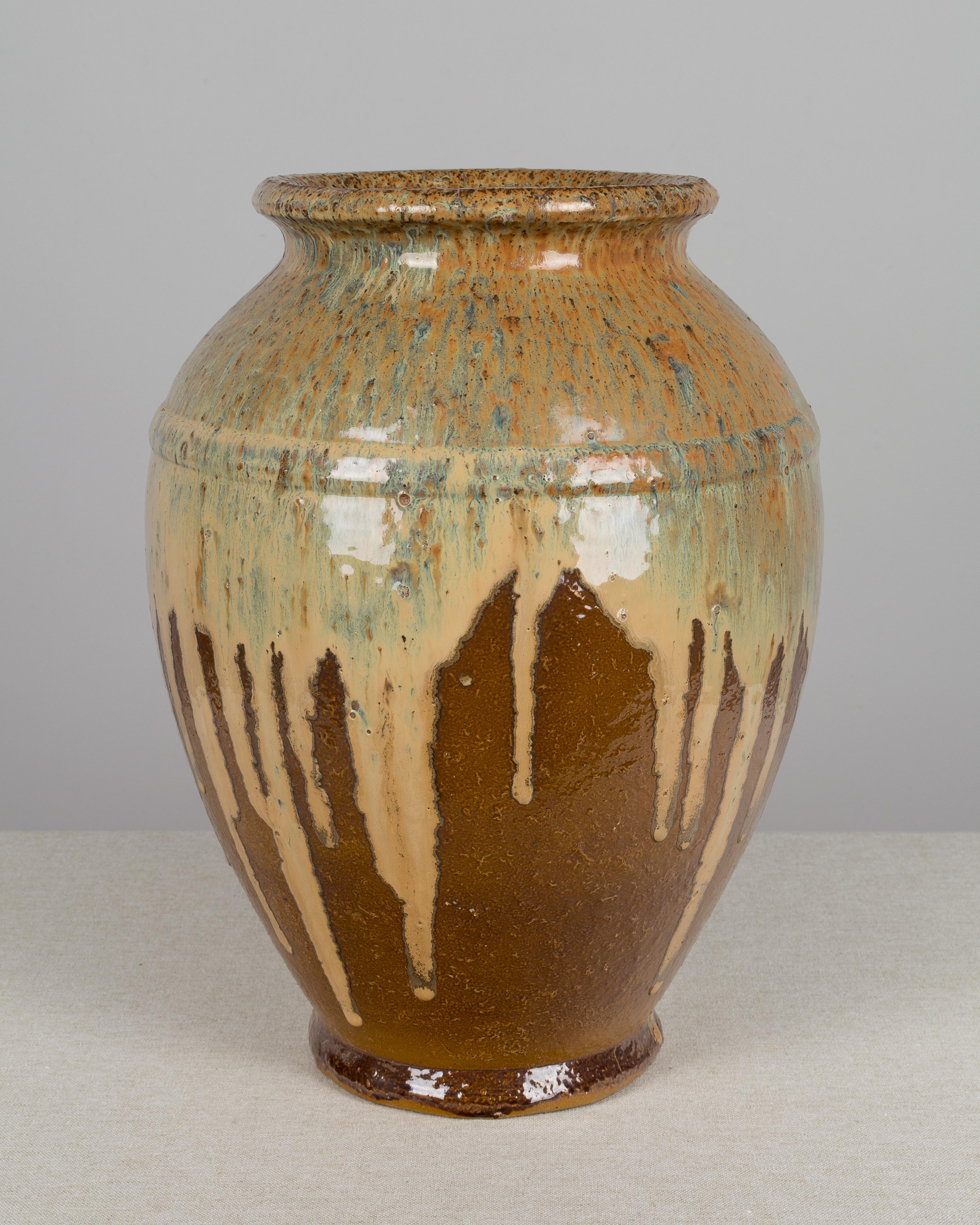 A French pottery vase from Beauvais in the North of France. Large heavy terracotta form with beautiful drip glaze. 18.5 lbs.