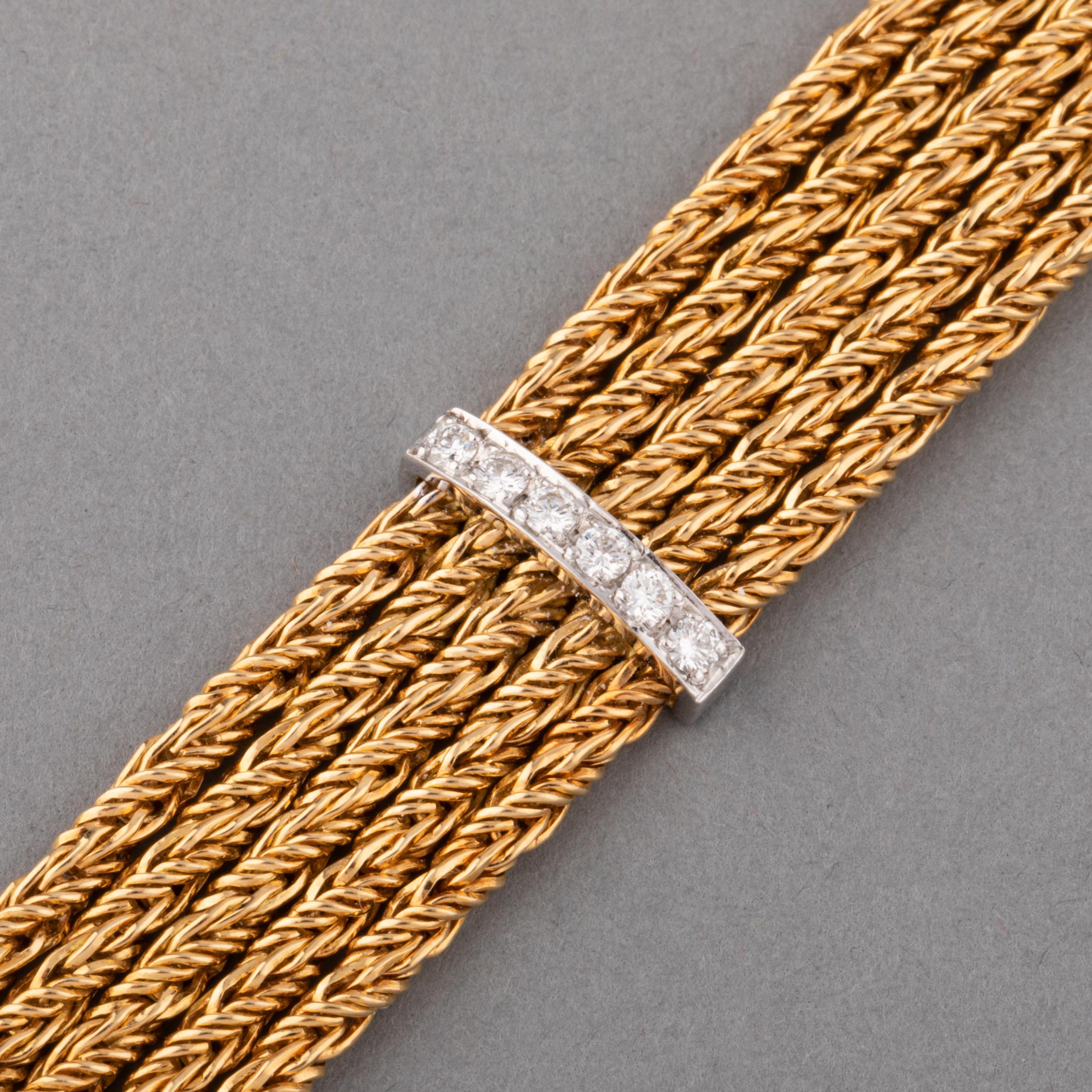 A very lovely vintage bracelet, made in France circa 1960.

Made in 18k gold and set with 2 carats of diamonds.
The length is 19cm and width 14mm.
Total weight: 42.20 grams.