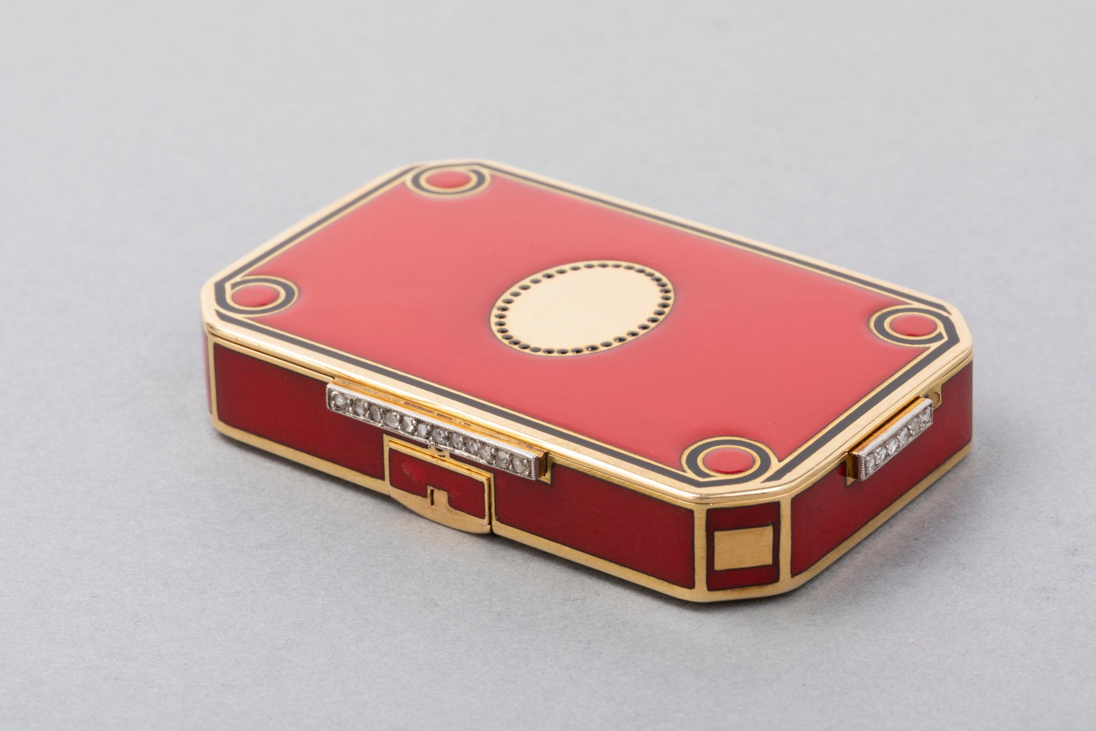 French Gold and Enamel Art deco Minaudière box 

Very lovely Minaudière box. Made in France circa 1925. 
18k gold (Eagle marks) and red enamel. The quality of making and the design is very beautiful.
There is a mirror inside, two compartments and