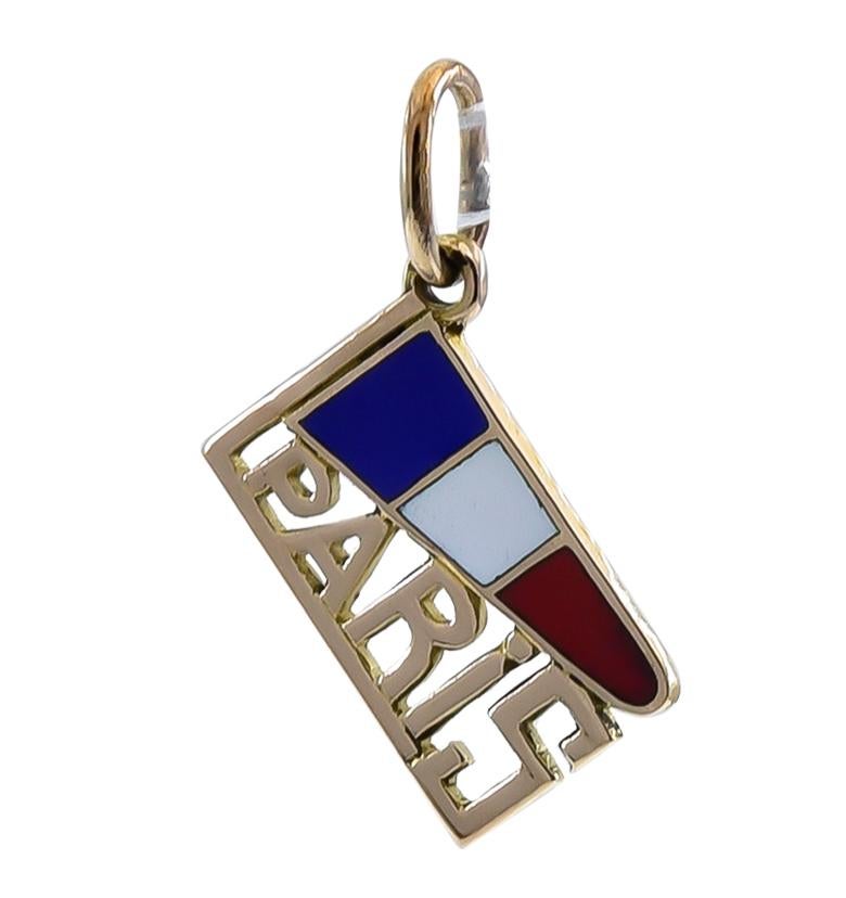 Lovely travel charm: a red, white and blue enamel French flag with cut-out letters spelling 