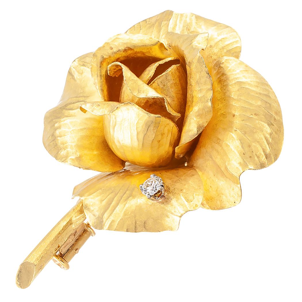 French gold and diamond rose clip brooch circa 1960 by G R Le Compte. Designed as a rose flower set with a single round brilliant-cut diamond weighing approximately 0.10 carat, approximately G – H color and VS clarity, mounted in 18-karat yellow