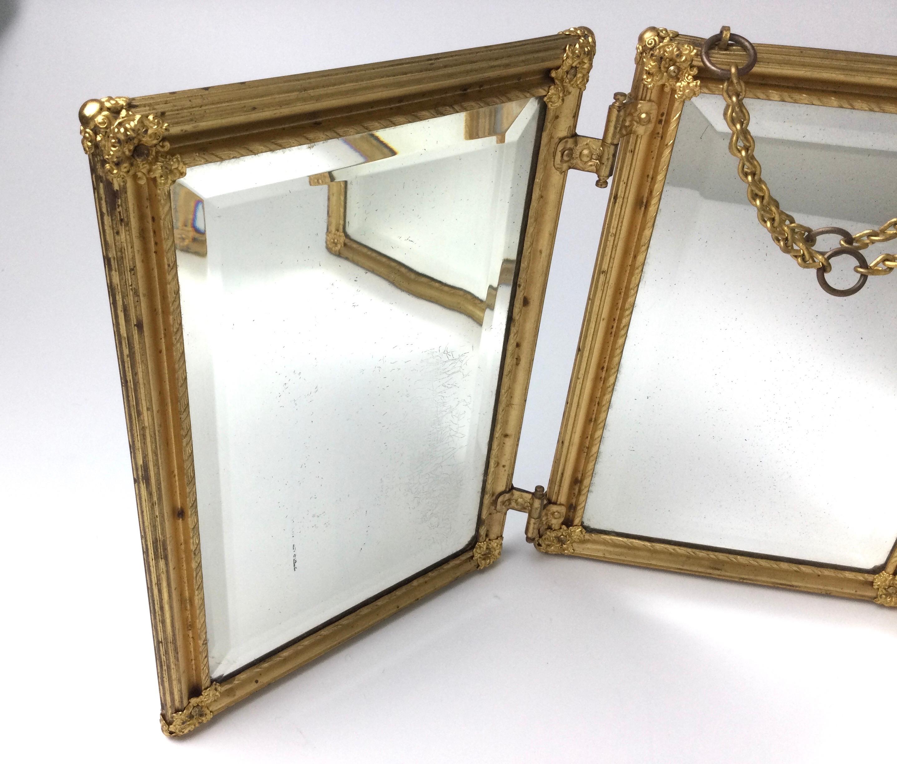 French gold gilded tribute-fold travel or dresser shaving mirror. Folds flat. Nice beveled mirrors on all three panels. Each panel measures 10 1/4 by 7 1/4