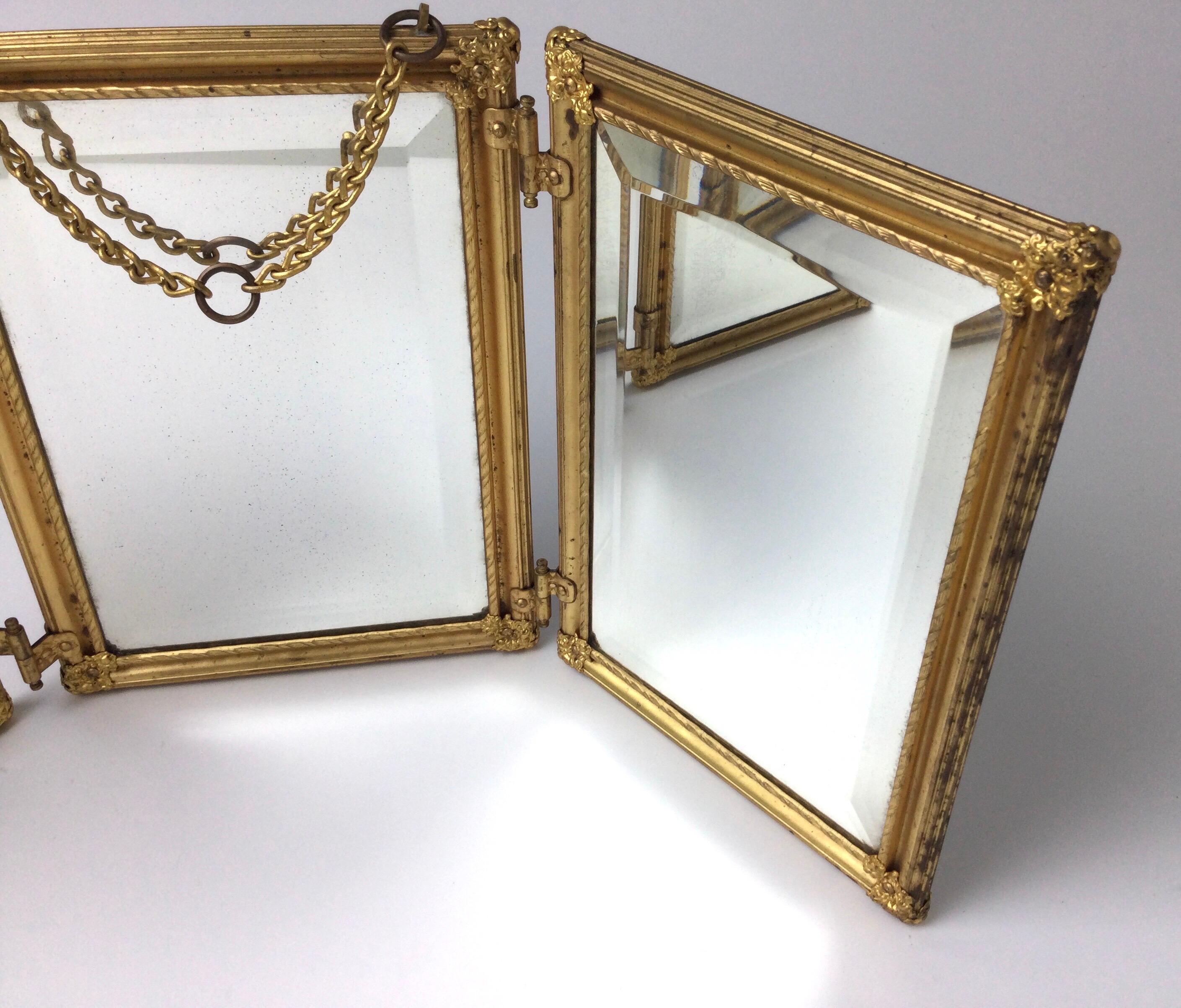 gold trifold mirror