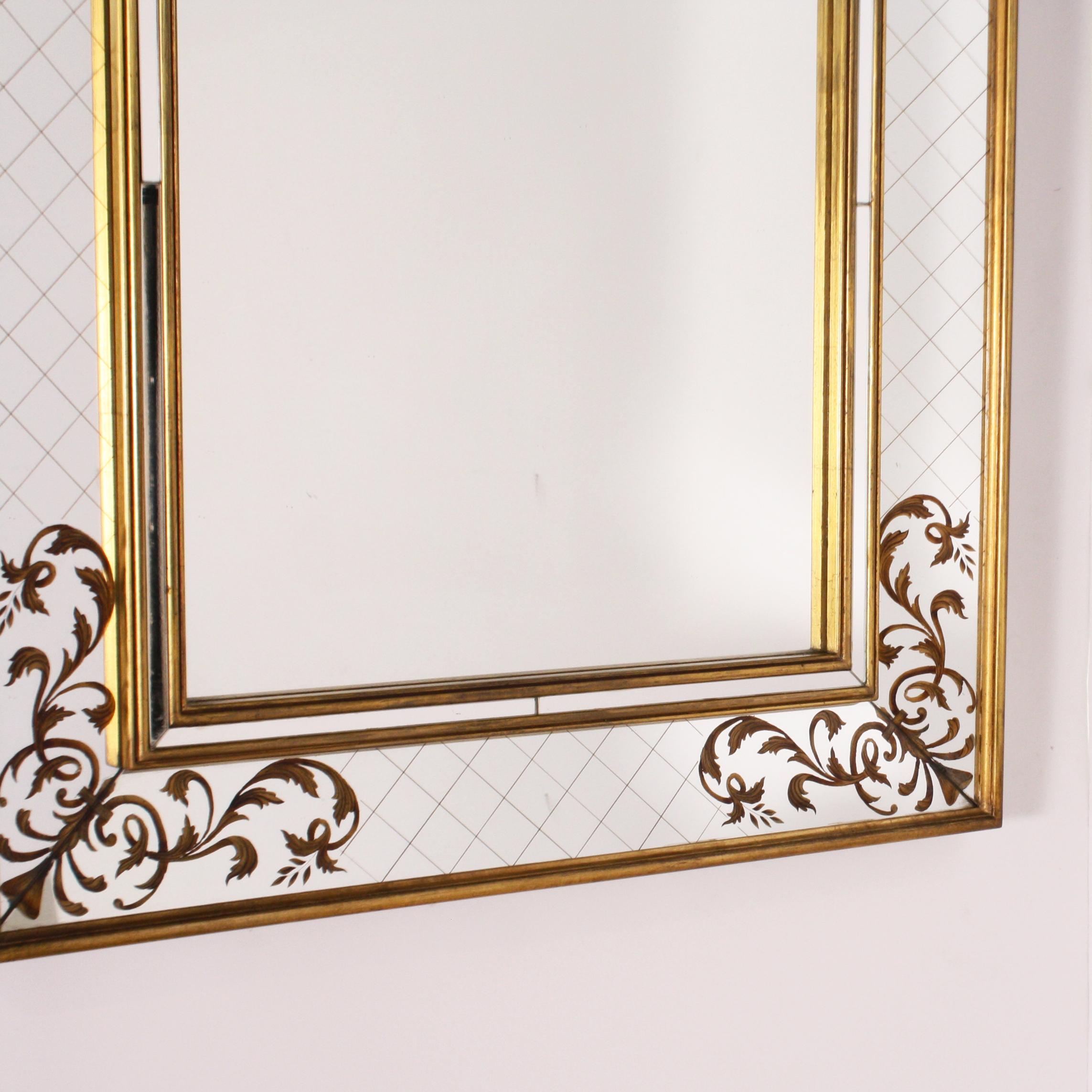 French gold leaf églomisé mirror with gold wood frame, circa 1940.