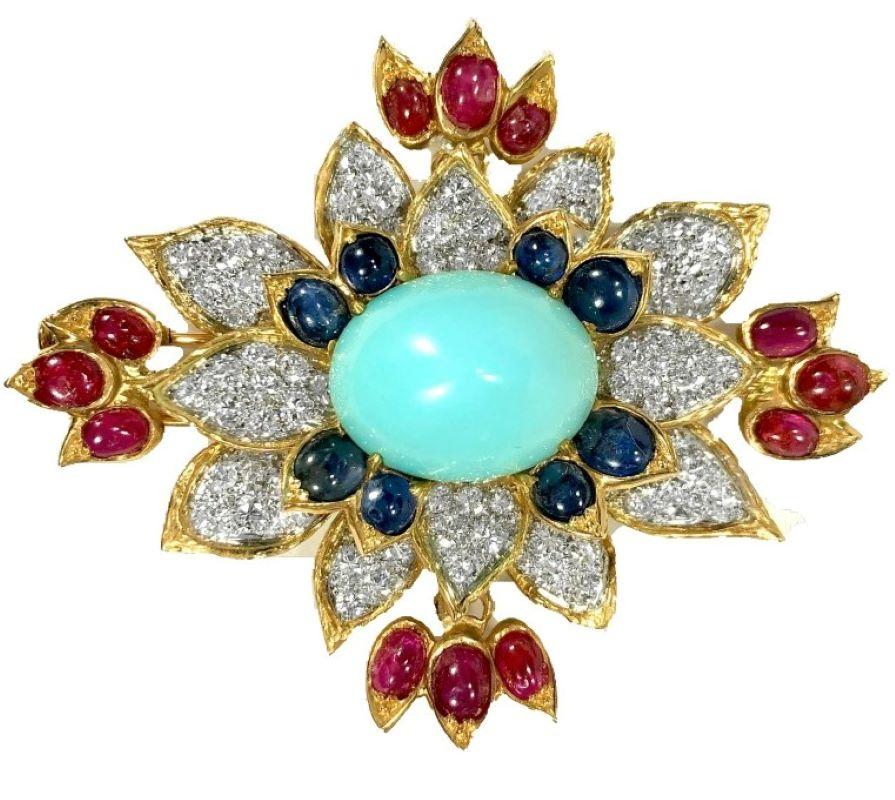 This iconic 1960's cocktail brooch is crafted from 18k yellow gold with all diamonds set in platinum plates. At it's center is one fine Persian turquoise sugar loaf cabochon measuring 3/4 inches by 5/8 inches surrounded by 82 brilliant cut diamonds