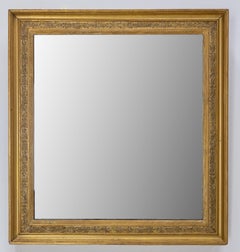 Miroir en stuc avec cadre doré à motifs végétaux, début du 20e siècle