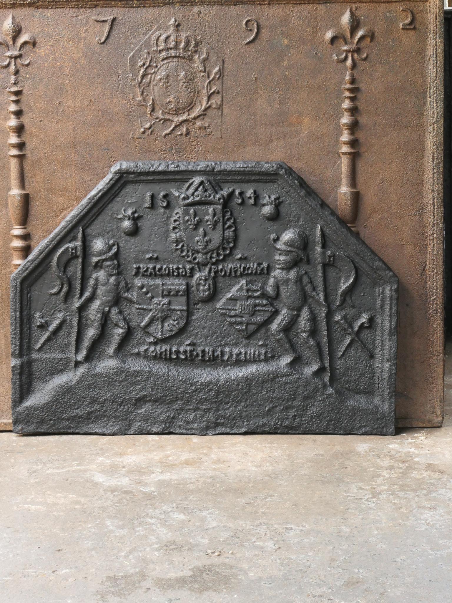 16th Century French Gothic fireback from the early days of casting firebacks. The date of production, 1554, is also cast in the fireback.

The fireback is made of cast iron and has black or pewter patina. The fireback is in a good condition,