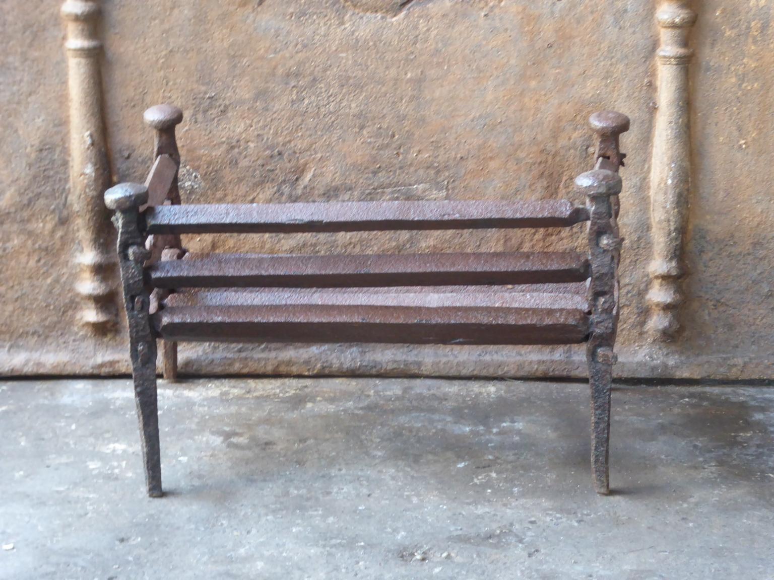 17th century French Gothic fire grate. Made of beautifully forged wrought iron. The fire grate has a natural brown patina. Upon request it can be made black / pewter. The total width of the front of the grate is 56 cm (22 inch).







  