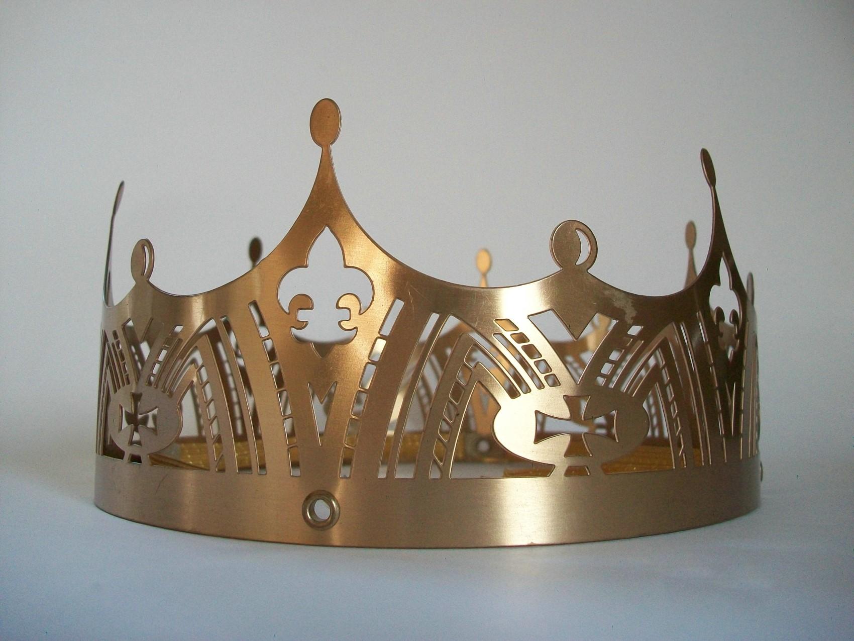 Gothic Revival style pierced metal crown (likely an Eastern Orthodox wedding crown) - Gothic tracery including fleur-de-lis, quatrefoil, crosses and arches - elastic band (fixed with rivets) to the interior - comes in original box (no lid) -