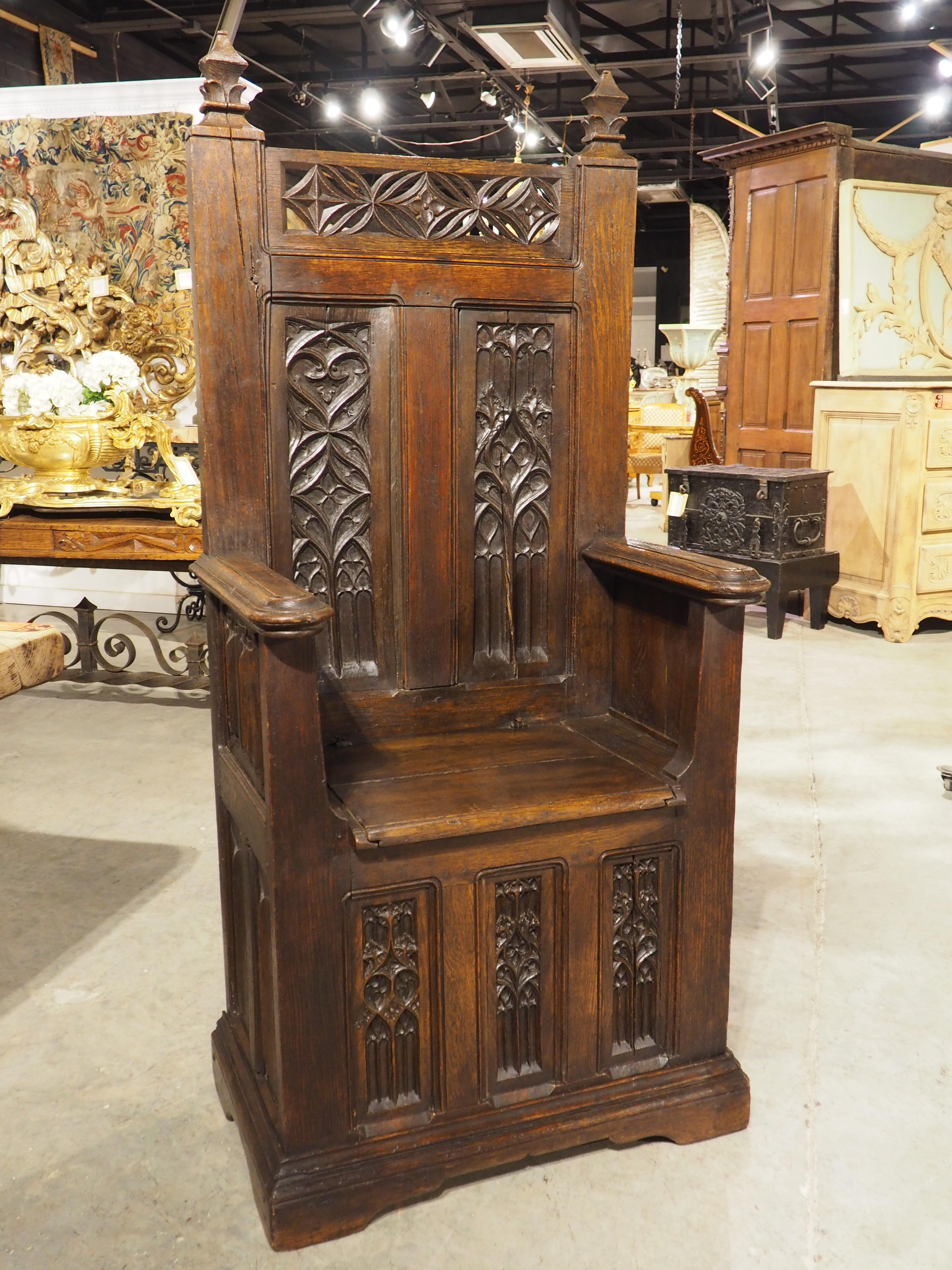 More information coming soon…

A French chayère throne chair, hand-carved in the late 1800s, using older Gothic-style panels.  Multiple panels of Gothic tracery and linenfold were incorporated into the construction of the chayère, which features a