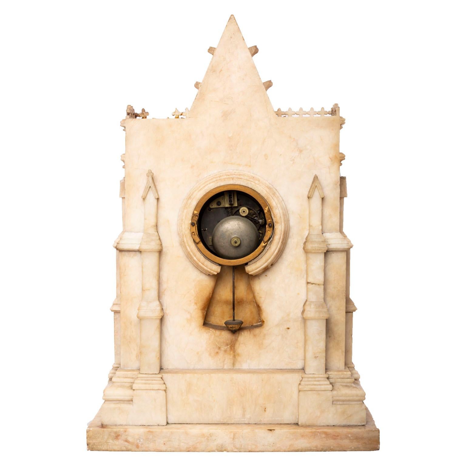 French Gothic style inlaid marble mantel clock.
Dial signed H. Azur à Paris. Height 21 inches, width 14 1/4 inches.