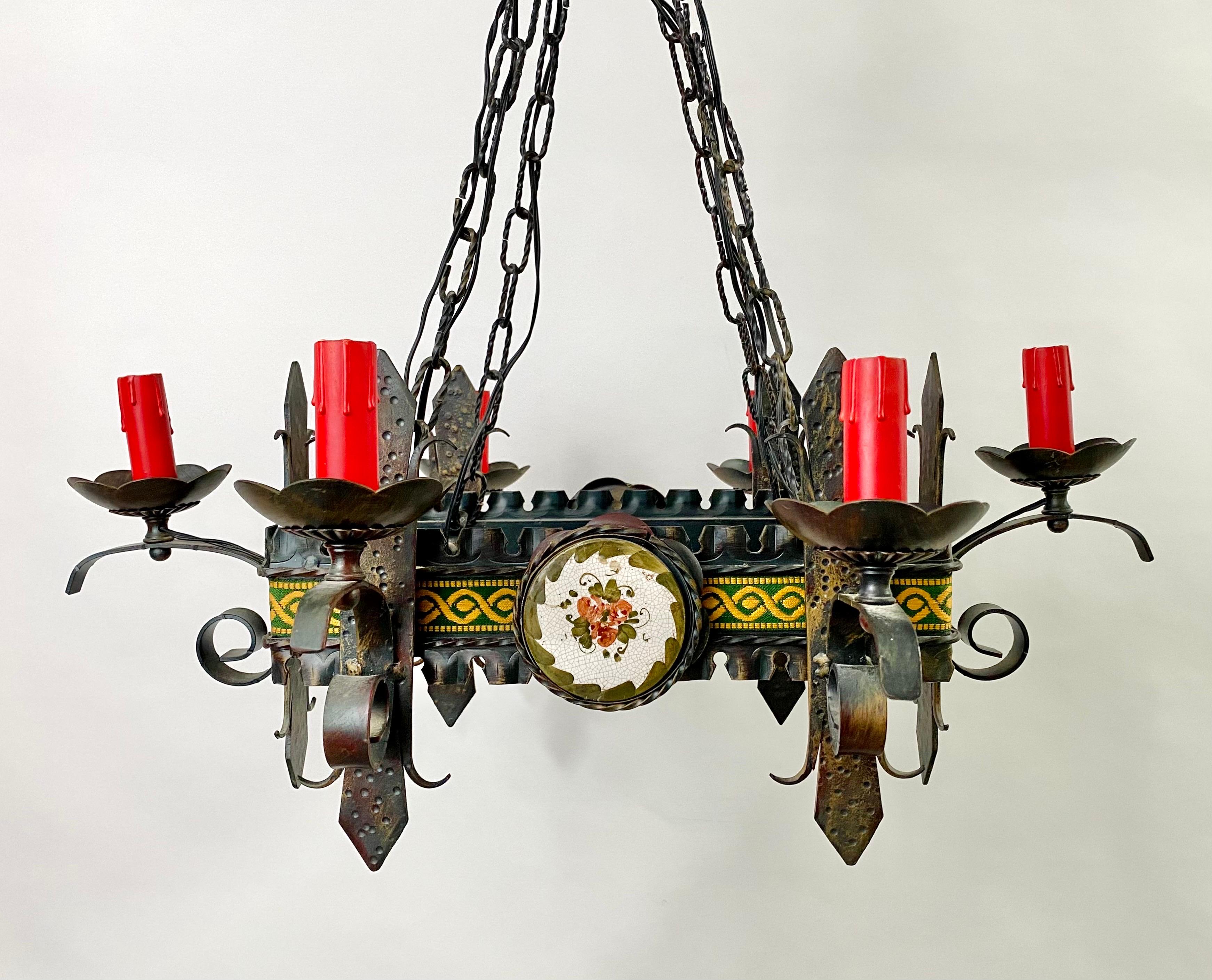 An exceptional 19th century French gothic style chandelier or pendant. The medieval style chandelier features a rectangular shape and has 6 lights . Finely carved of wrought iron, the chandelier shows amazing and intricate scrolls and swords design.