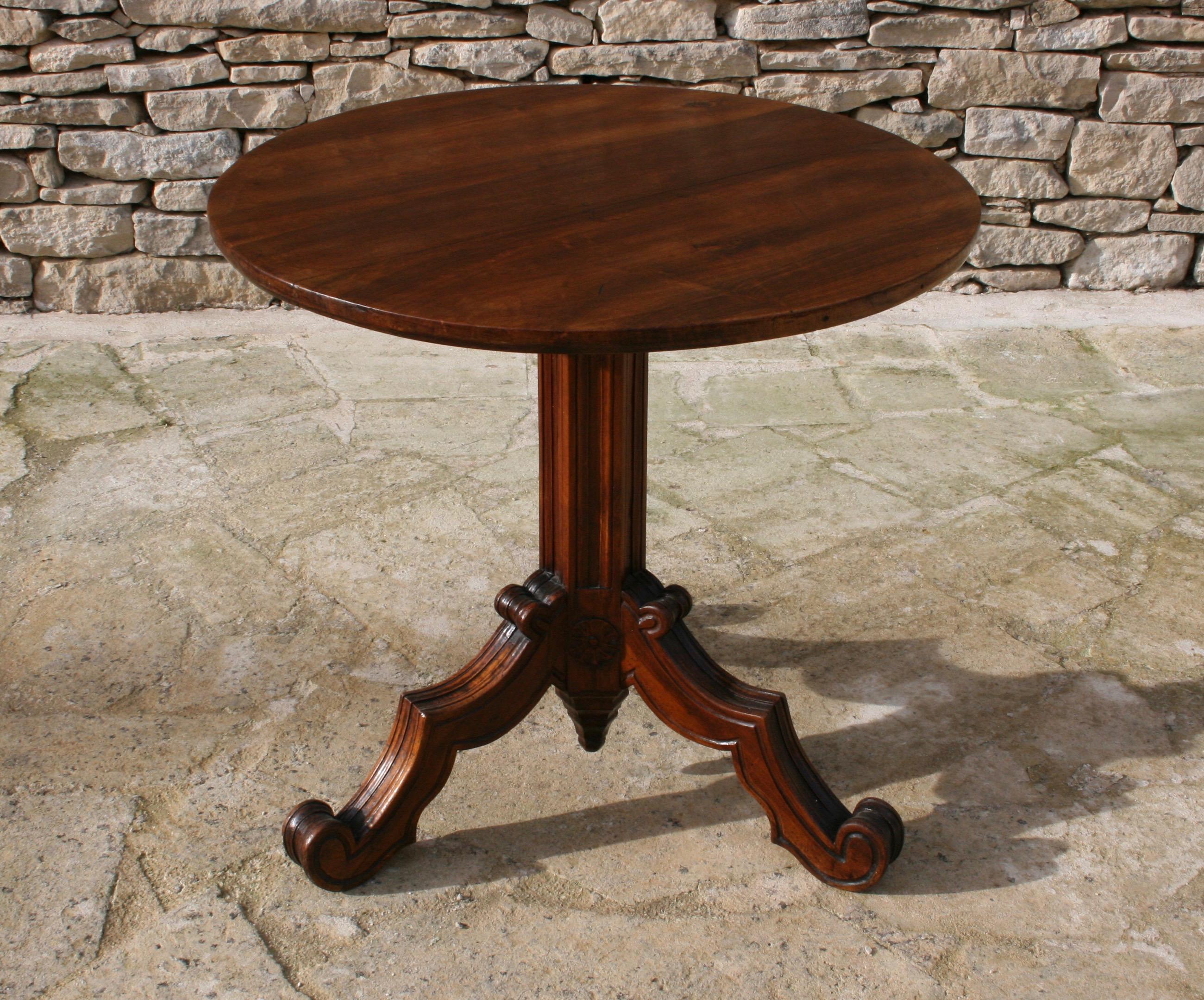 A wonderful and handsome French Gothic side table, with elegant carved pedestal base and in very fine condition mahogany tilt-top.
