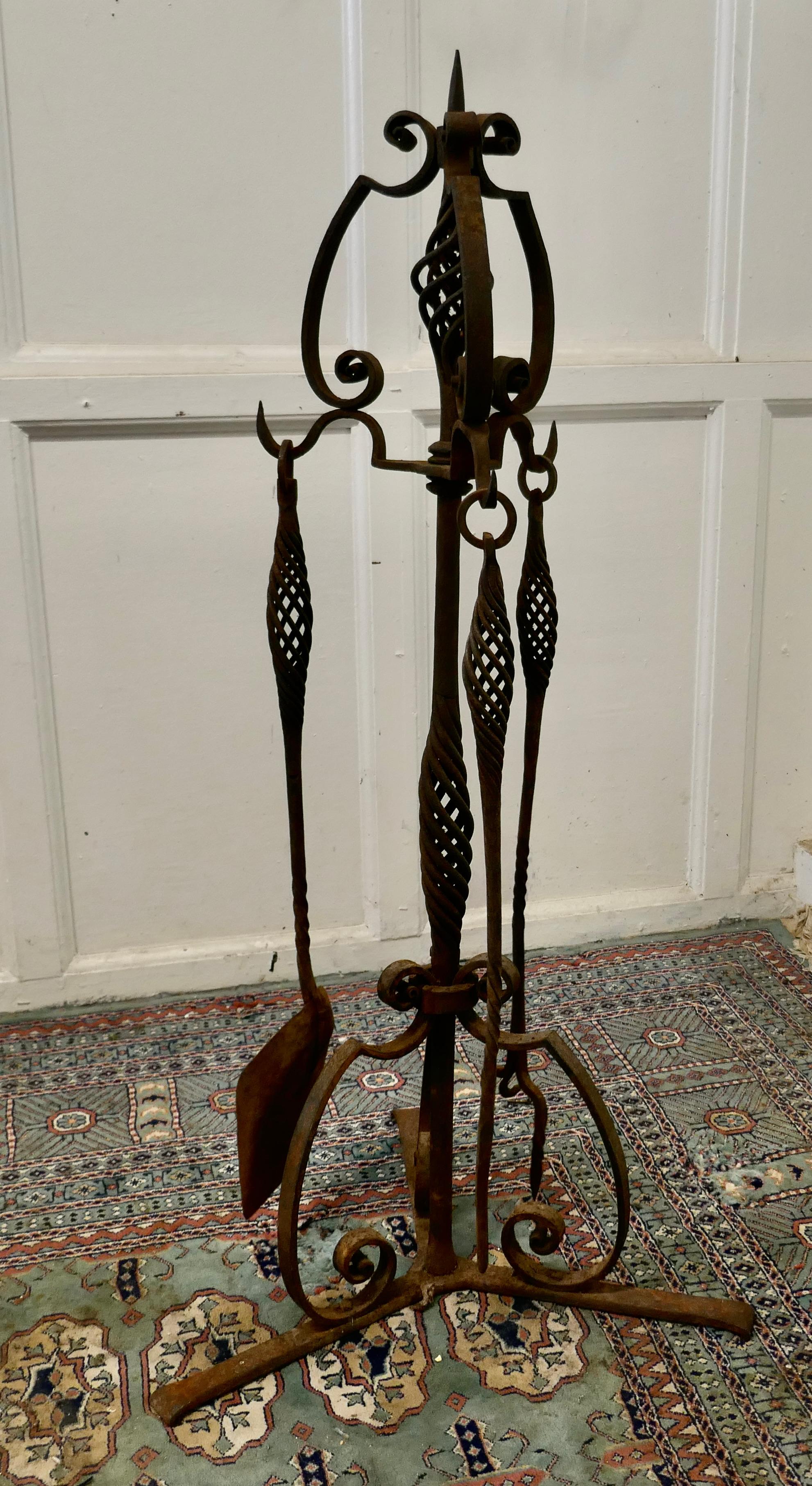 French Gothic wrought iron manor house fire tool companion set


The stand is very large and heavy, it dates from the early 19th century and comes from a Brittany Manor House
This is a very unusual piece, it has been made for a large fire it has