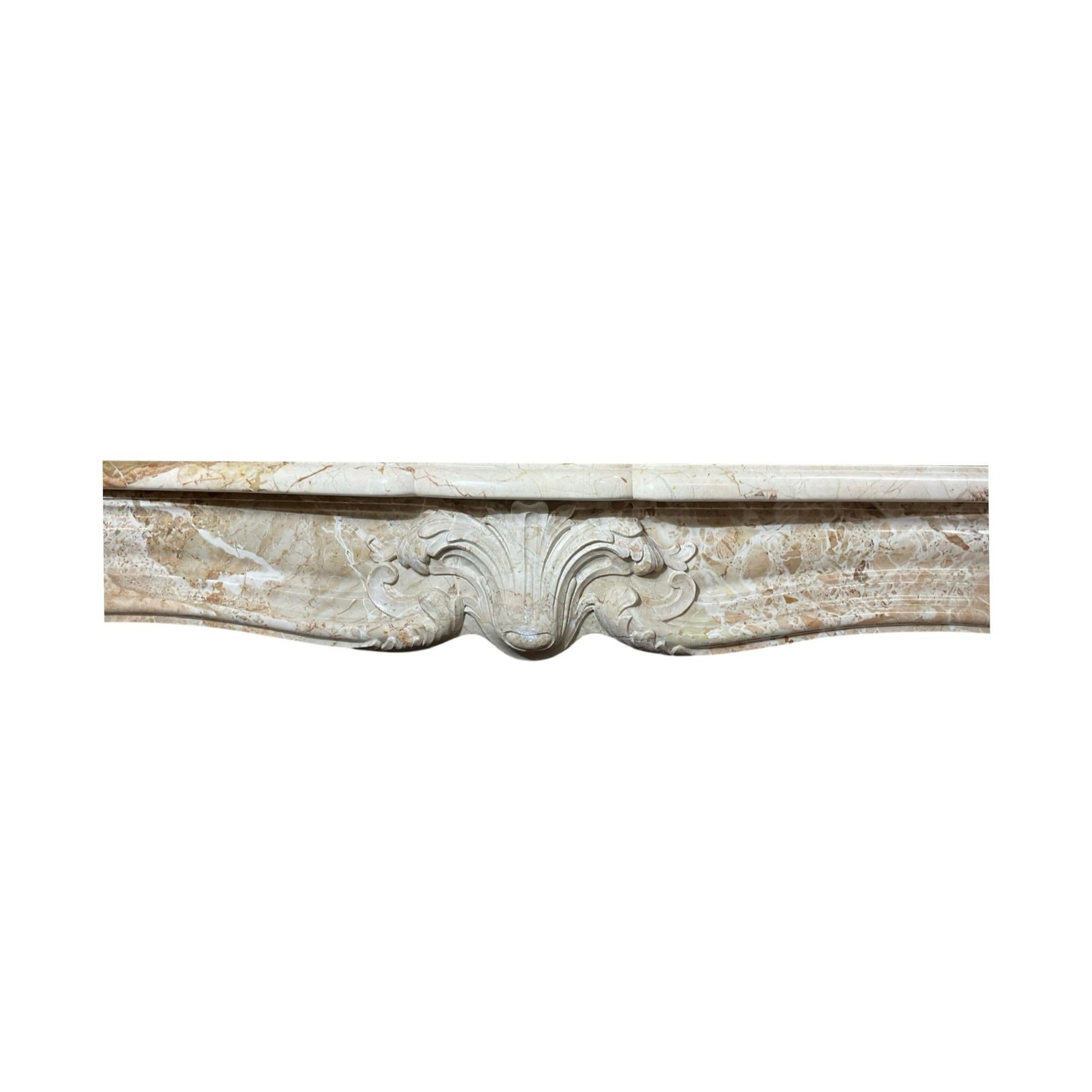 This beautiful French Grand Mix Napoleon Marble Mantel is an exquisite piece from 1880. It is crafted from grand mix Napoleon marble and adorned with Louis XVI style carvings, adding a touch of elegance to any room.