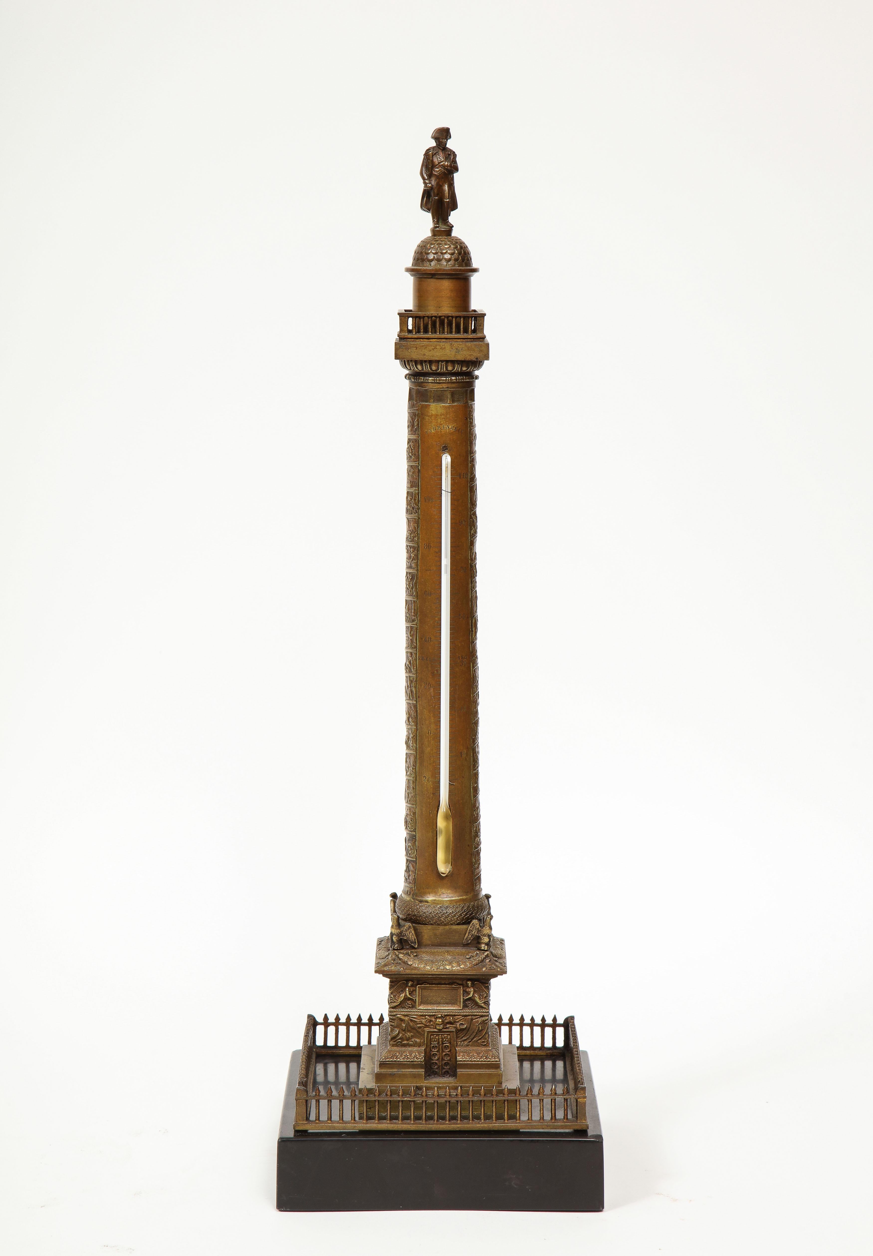 French Grand Tour bronze column thermometer of the place Vendome in Paris, 19th century.

The figure of Napoleon standing atop the spiralling column with square black marble plinth.

The original column was started in 1806 at Napoleon’s