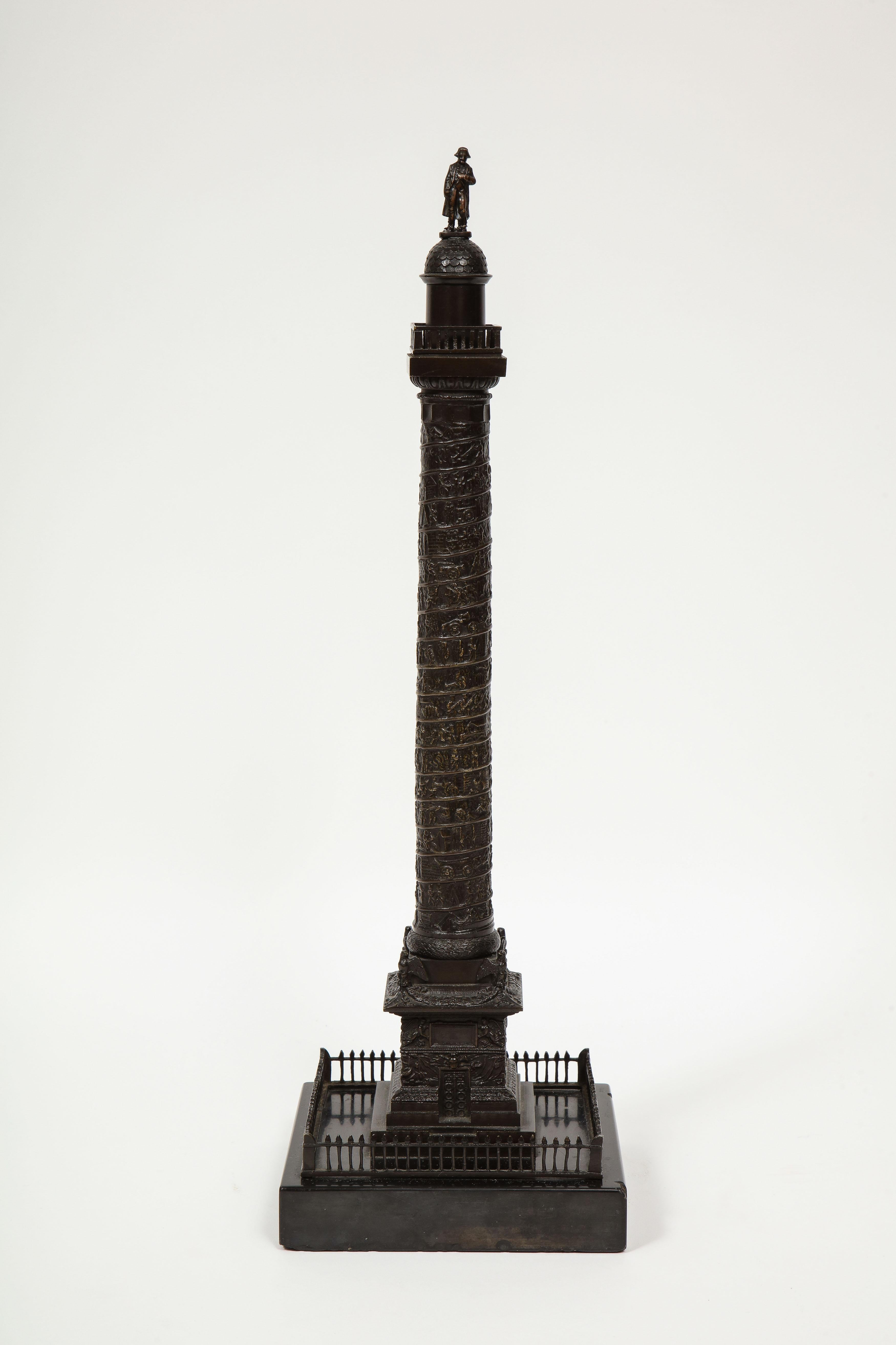 French Grand Tour bronze column of the place Vendome in Paris, 19th century

The figure of Napoleon standing atop the spiraling column with square black marble plinth.

The original column was started in 1806 at Napoleon’s direction to celebrate