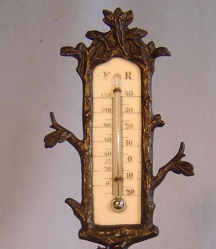 A fine and unusual French antique Grand Tour table thermometer in patinated bronze. Set upon a naturalistic trefoil shaped patinated bronze base with an animalier group of a stallion and Mare remeniscent of Mene's famous 