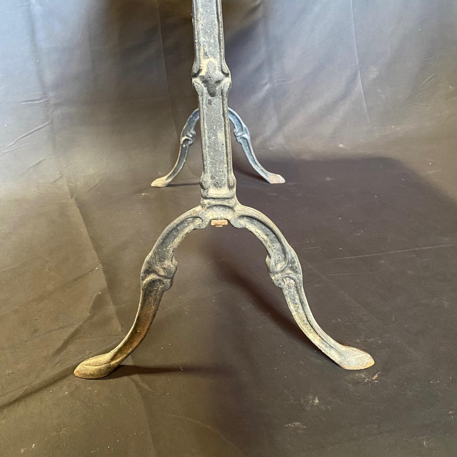 Versatile French marble top gray cafe table or writing desk with a classic Provincial iron base. Marble is a stunning early gray marble with side ridged bevel: very nice edge on all four sides - and could be in the center of a room, and could also