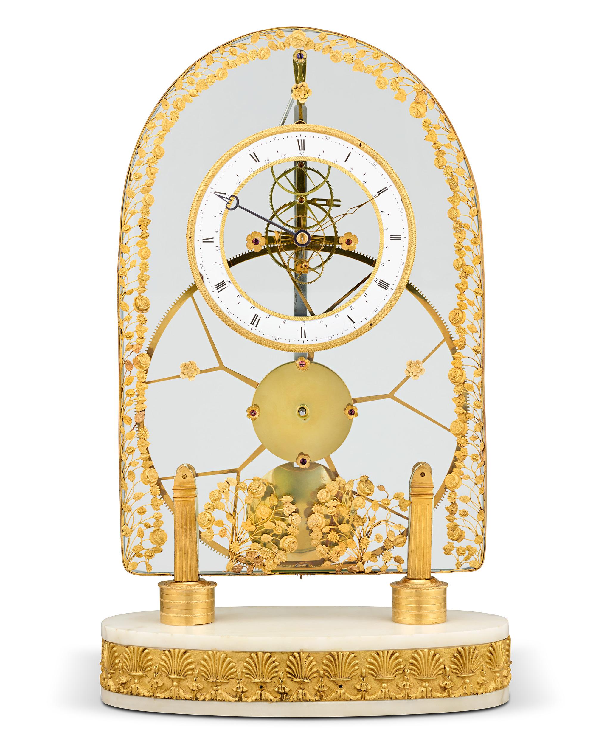 This important glass-fronted French Empire great wheel skeleton clock has the remarkable ability to run with incredible accuracy for more than a week on a single winding. The large central wheel and the rare combination of the pin-wheel escapement