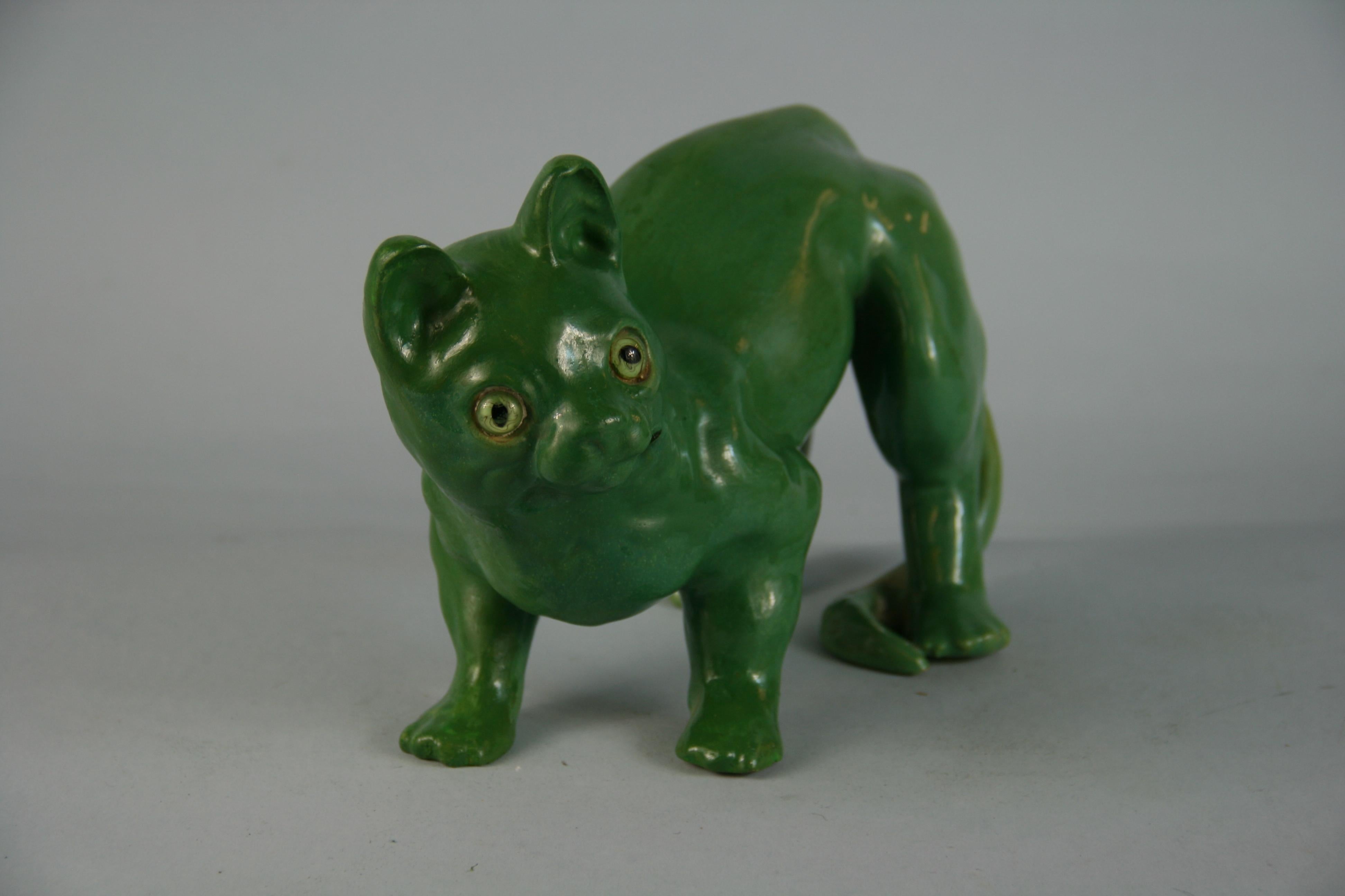3-635 French ceramic cat with green glass eyes.