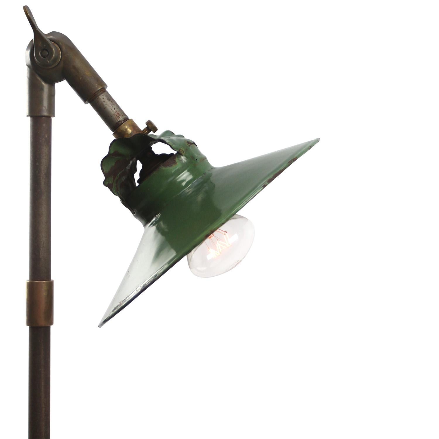 1930s Green enamel, cast iron industrial 3 arm machinist work light
adjustable in height 

Diameter Wall plate 10,5 cm / 4 inches

Priced per individual item. All lamps have been made suitable by international standards for incandescent light bulbs,