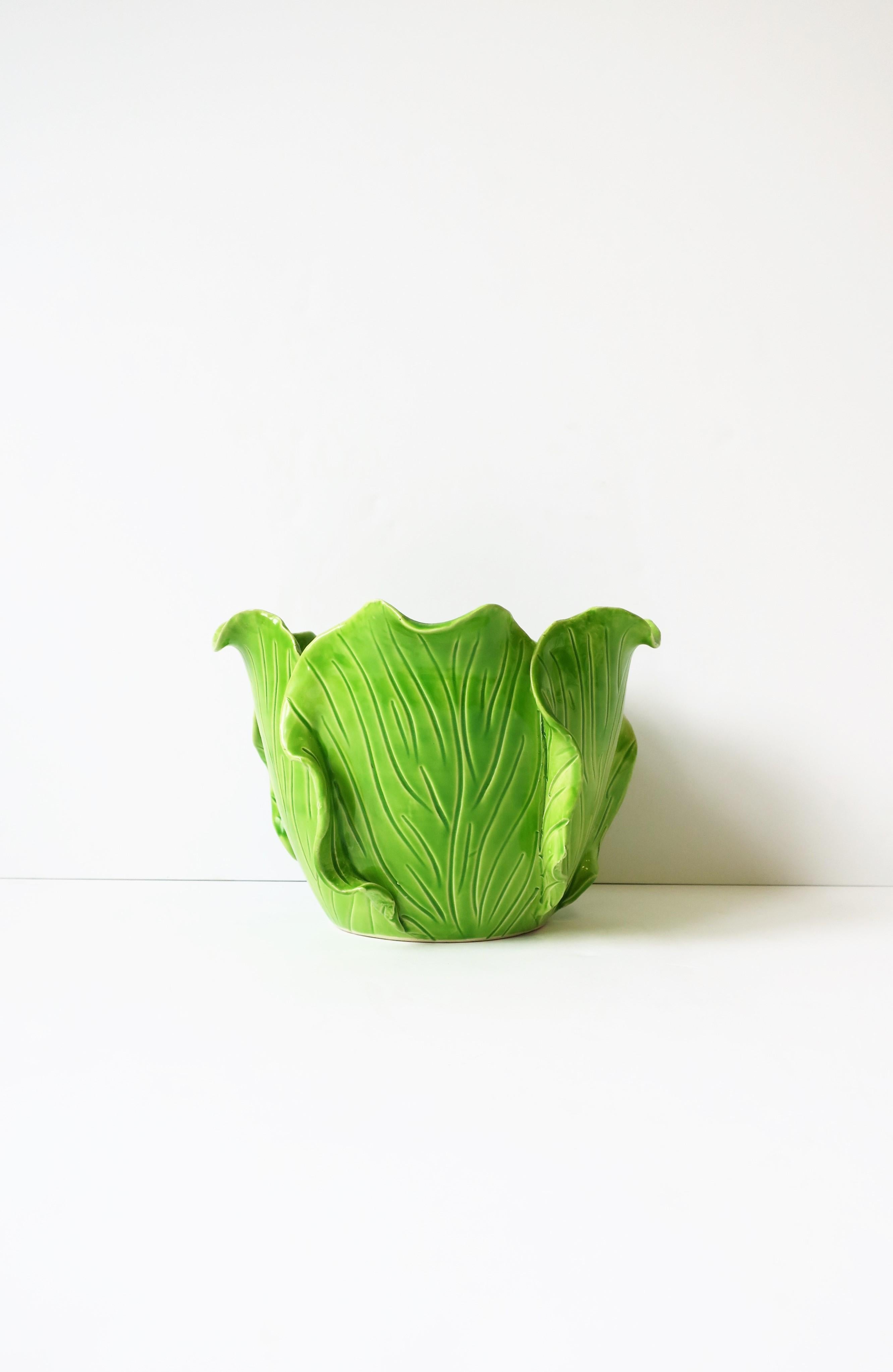 A beautiful and rare hand-made French green ceramic lettuce cabbage leaf or flower plant leaf cachepot jardinière plant or flowerpot holder from Maison Jean Roger by ceramist designer Jean Roger, Paris, France, circa 20th century. Piece could also